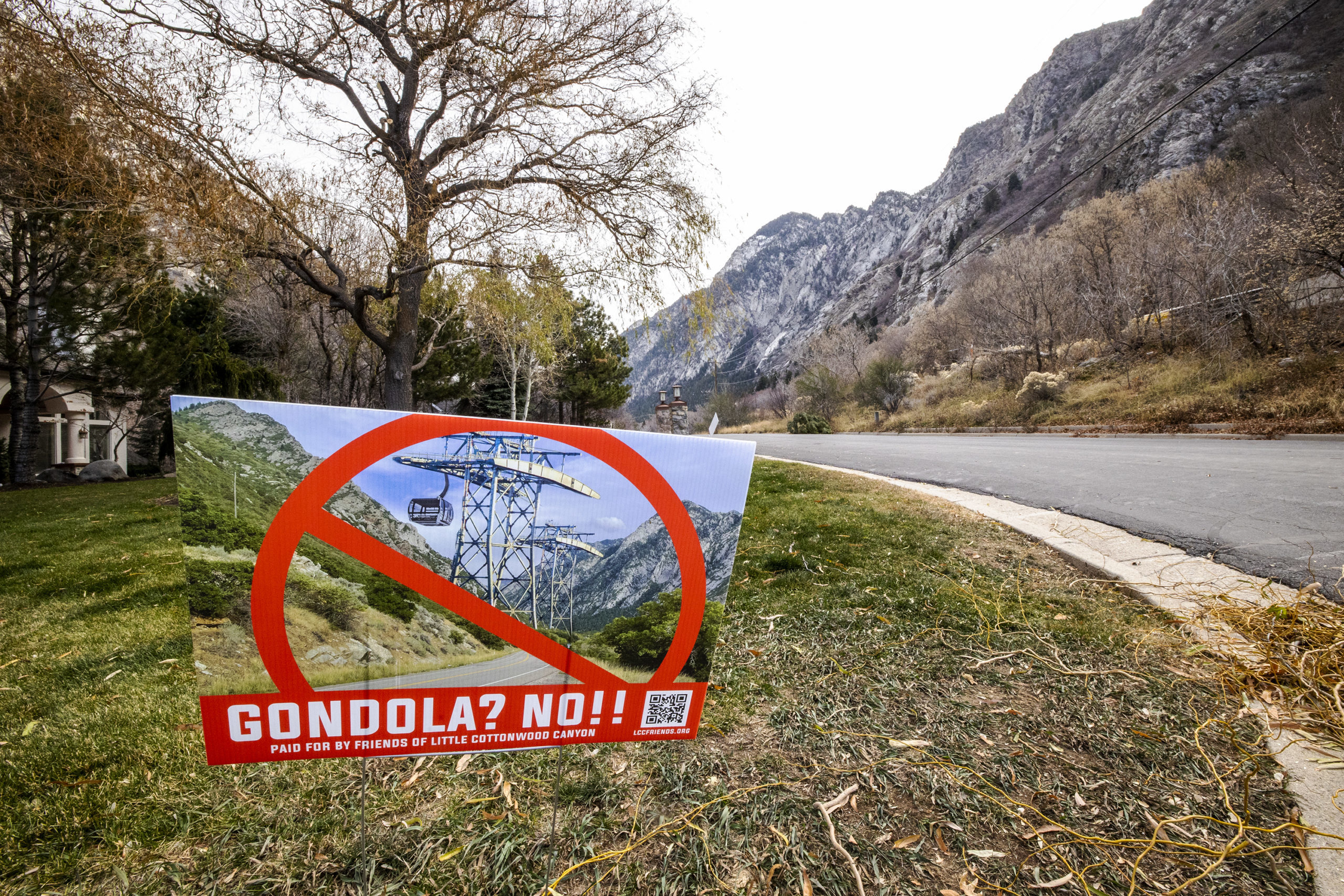 Signs in yards and area at the mouth of Little Cottonwood Canyon regarding the proposed gondola in ...