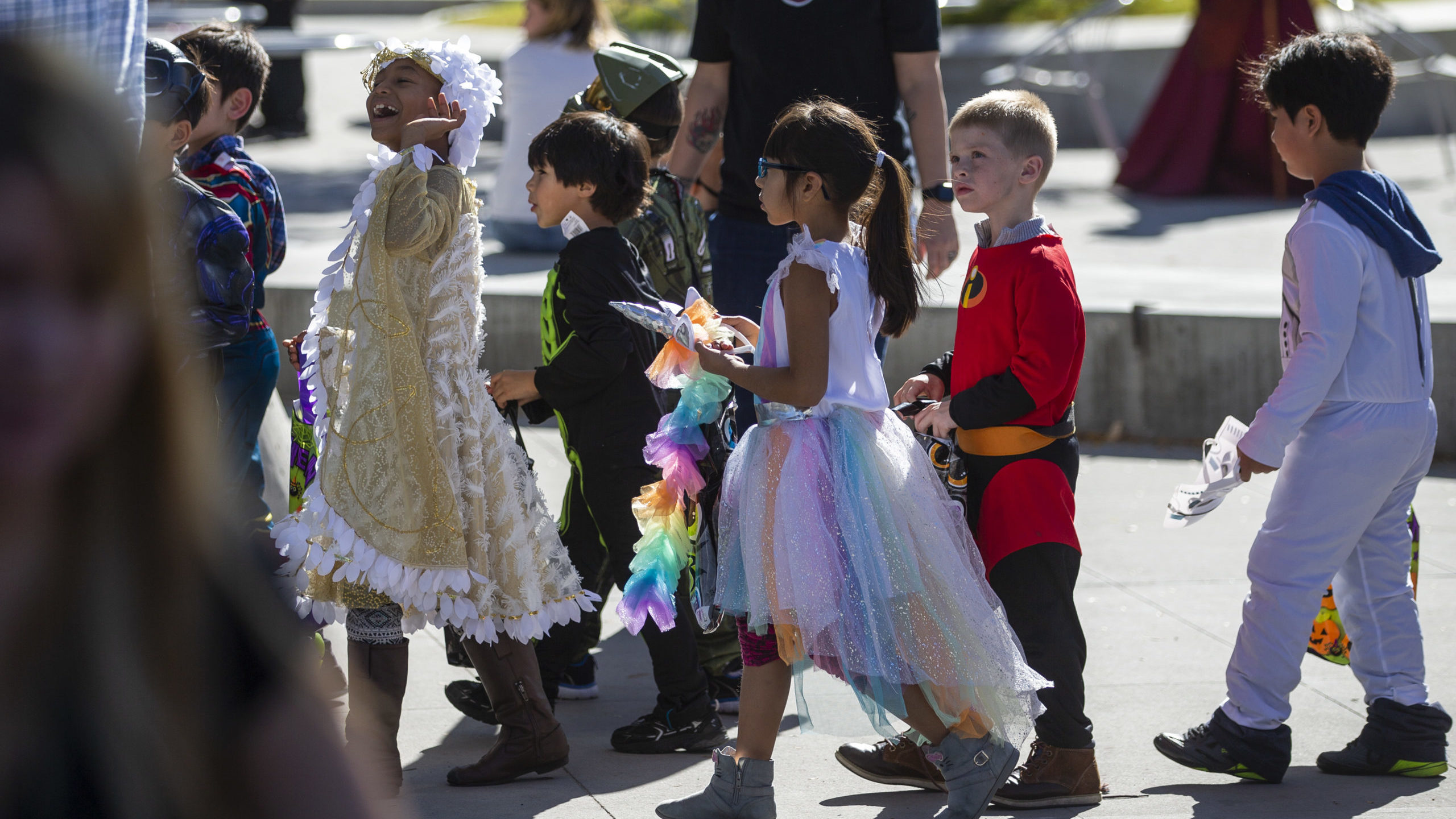 kids in halloween costumes pictured, keep kids safe with our halloween safety tips...