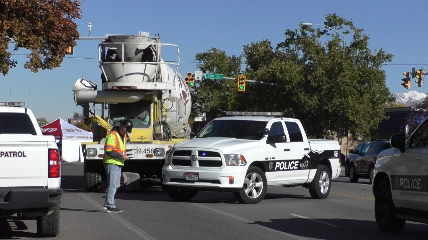 Cement truck and police truck pictured in logan...