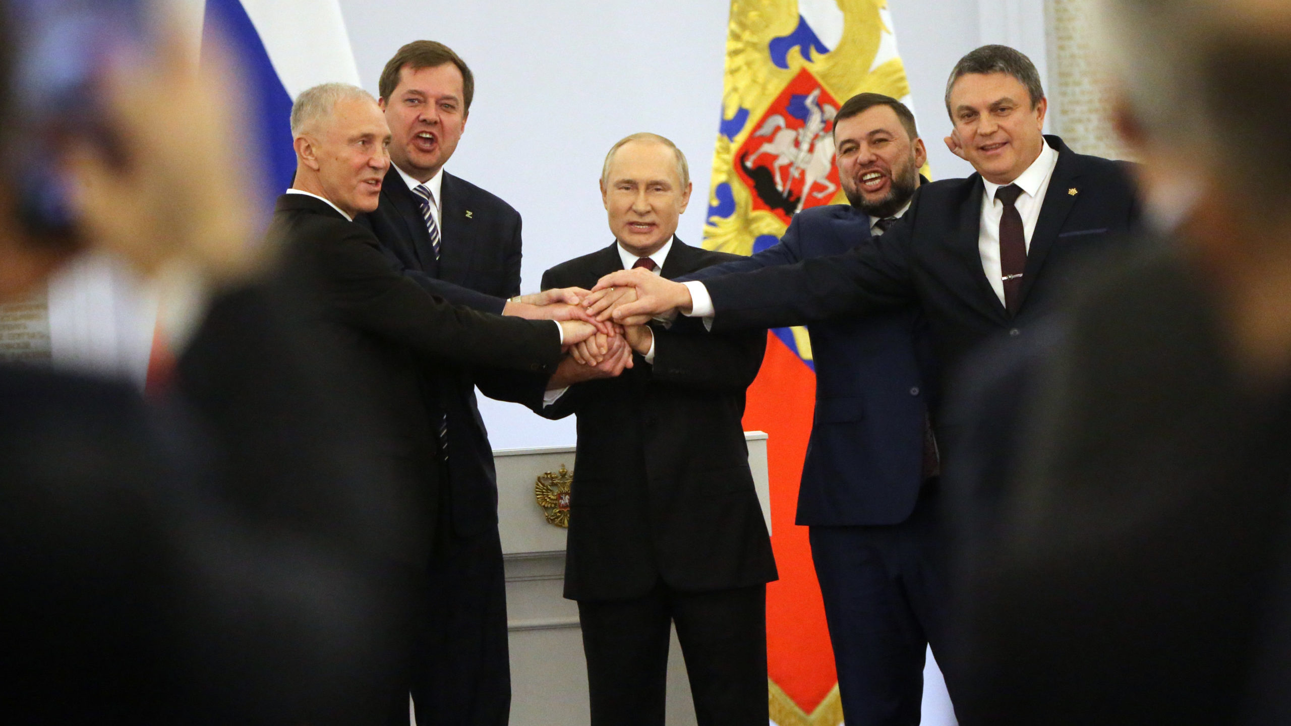 Russian President Vladimir Putin (C) with Ukrainian separatist regional leaders Vladimir Saldo (L),...