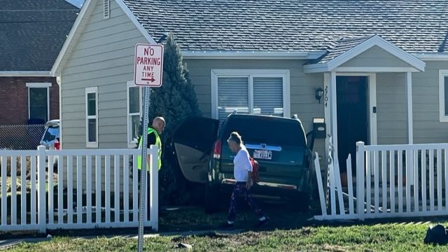 Ogden car crash is pictured, a car is crashed into a house...