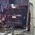 Vehicle collides with unoccupied building in Roy, no injuries