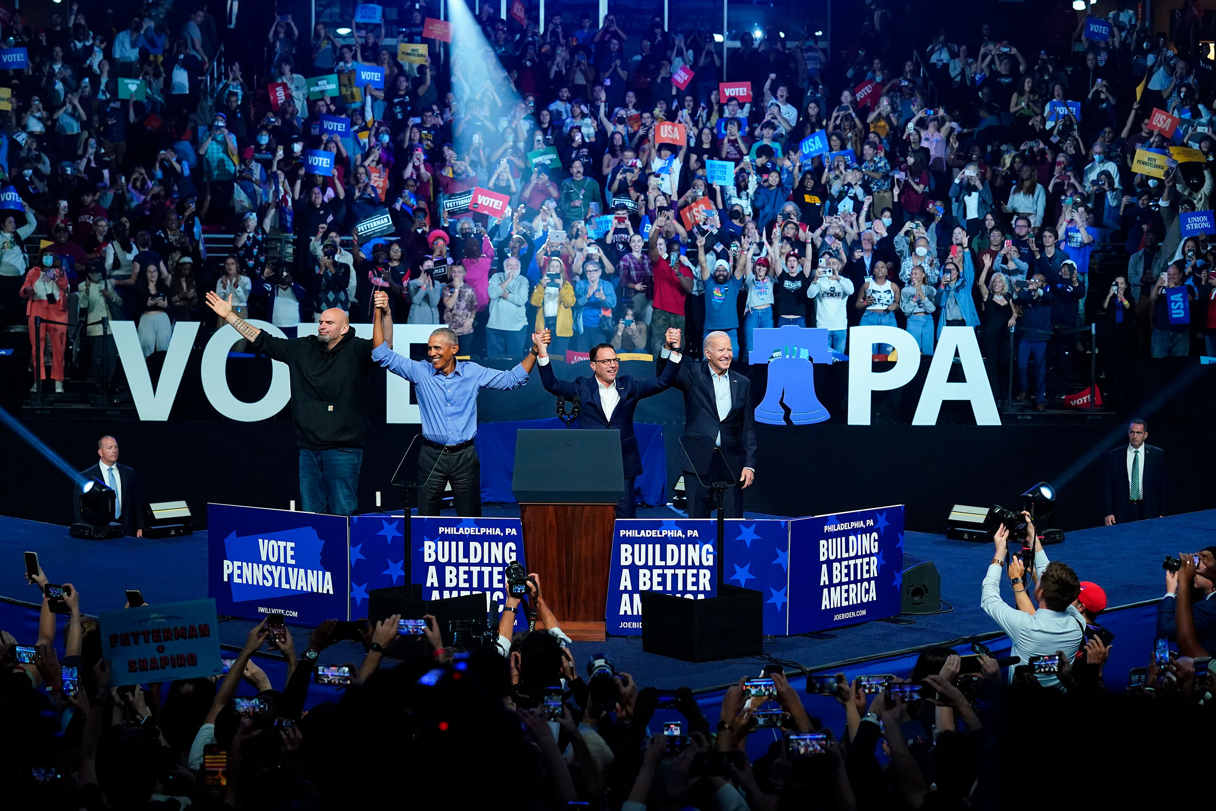 President Joe Biden, right, and former President Barack Obama, center left, take part in a campaign...