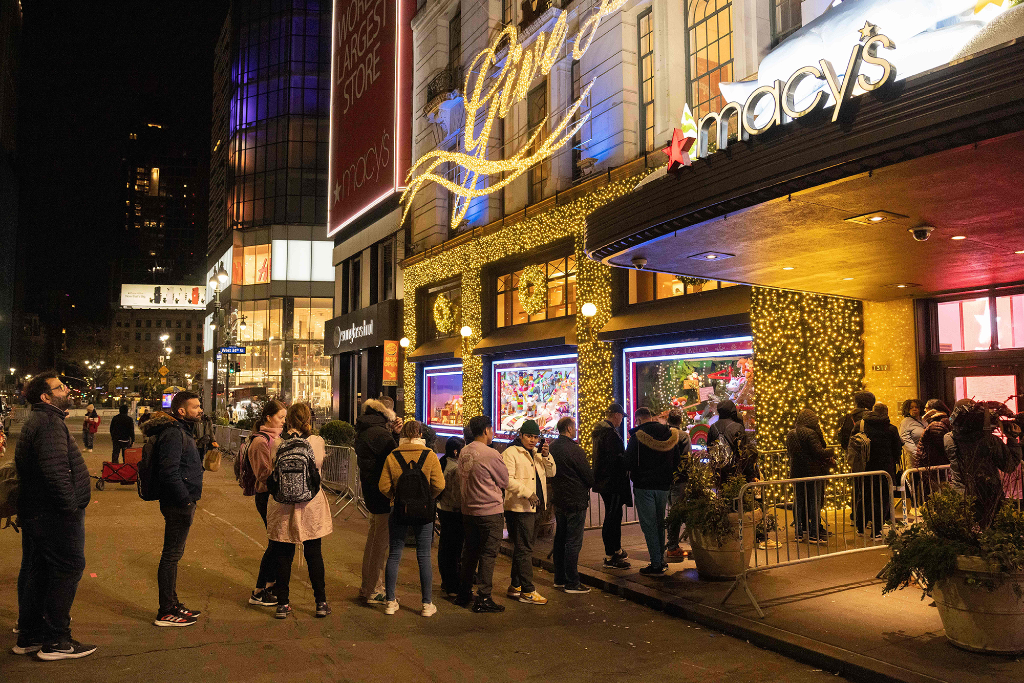 People wait in line to enter Macy's department store during Black Friday in New York City on Novemb...