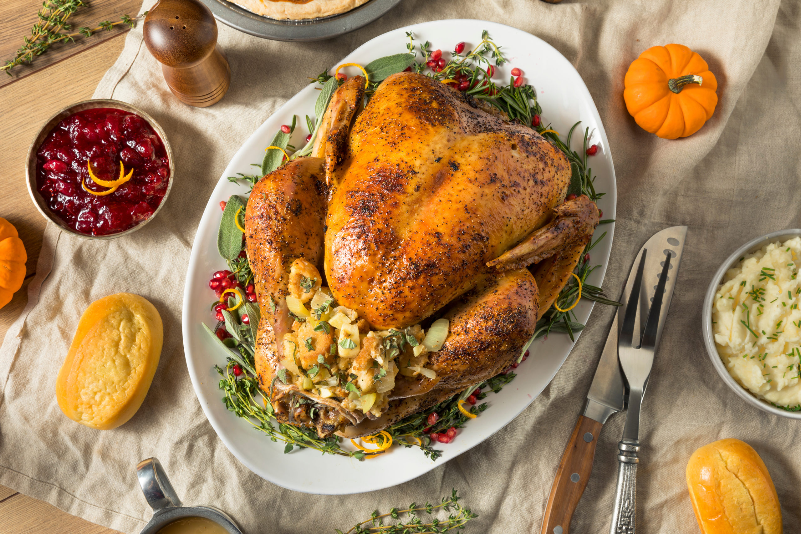 Whole Roasted Turkey Dinner For Thanksgiving with All the Sides (Adobe stock)...