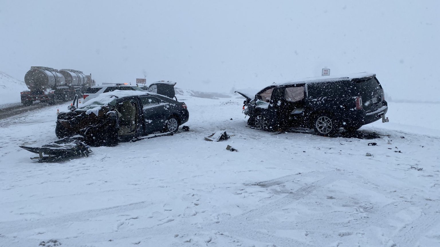 the scene of the crash in wasatch county is pictured, two cars are pictured wrecked...