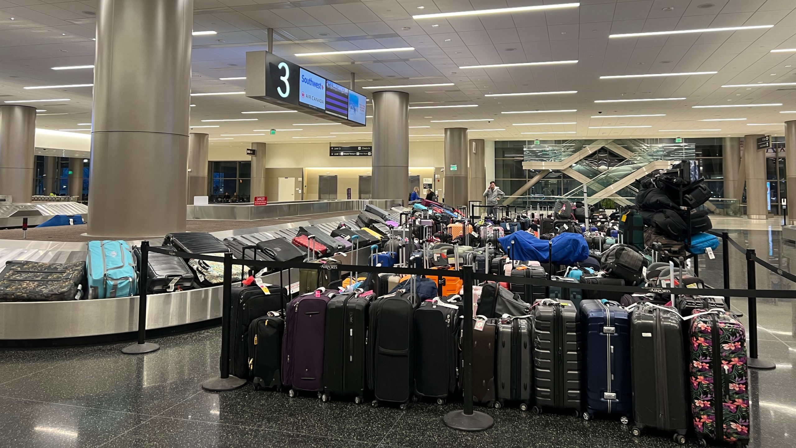 salt lake international airport baggage claim is full after cancellations...
