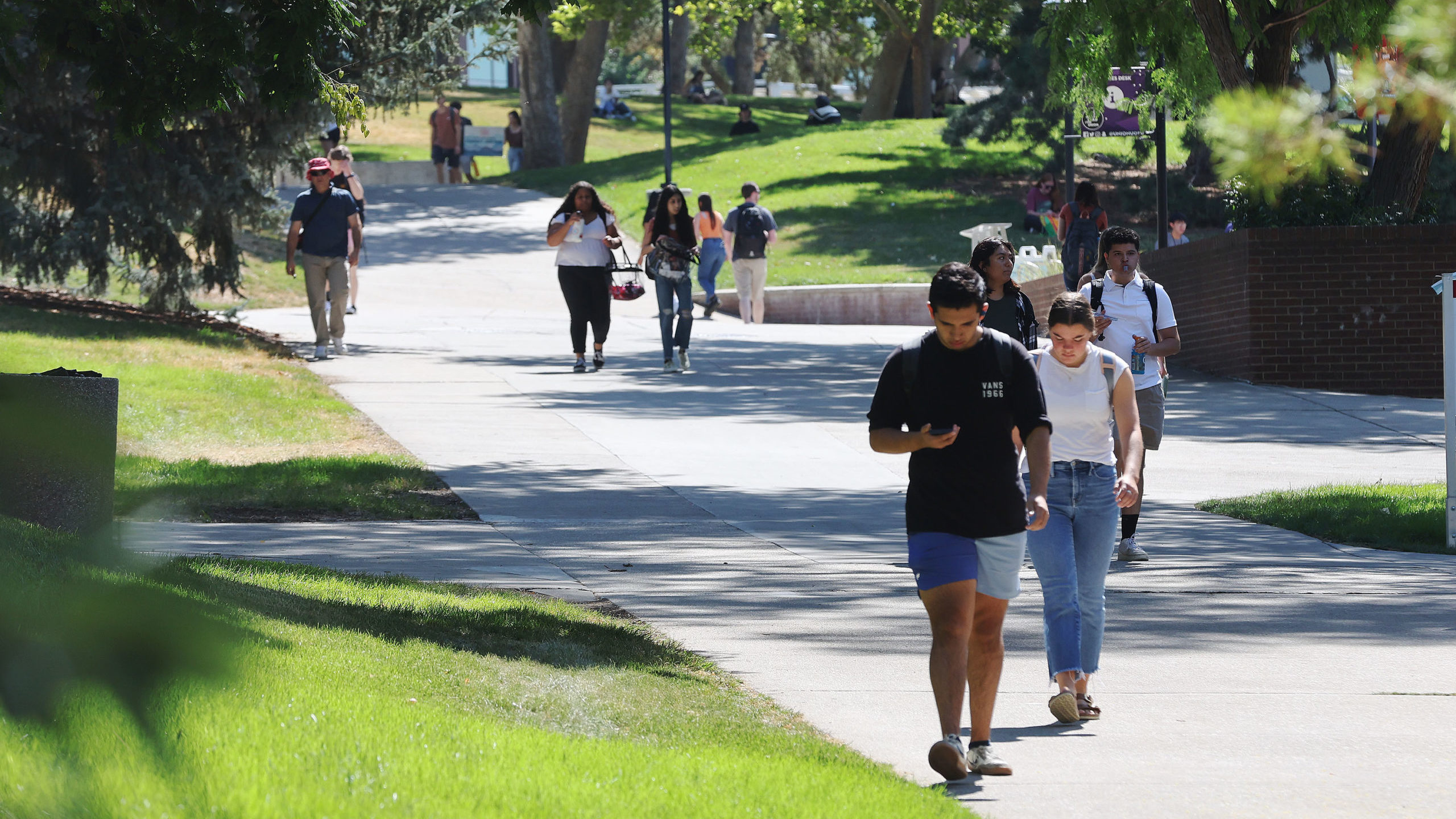 students walk on the U of U campus, political positions from a public college or university is no l...