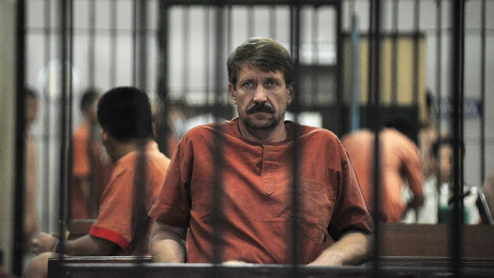 Alleged Russian arms dealer Viktor Bout sits in a temporary cell ahead of a hearing at the Criminal...