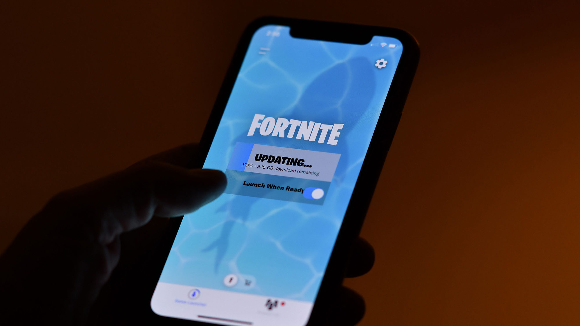 fortnite is pictured on a cell phone...