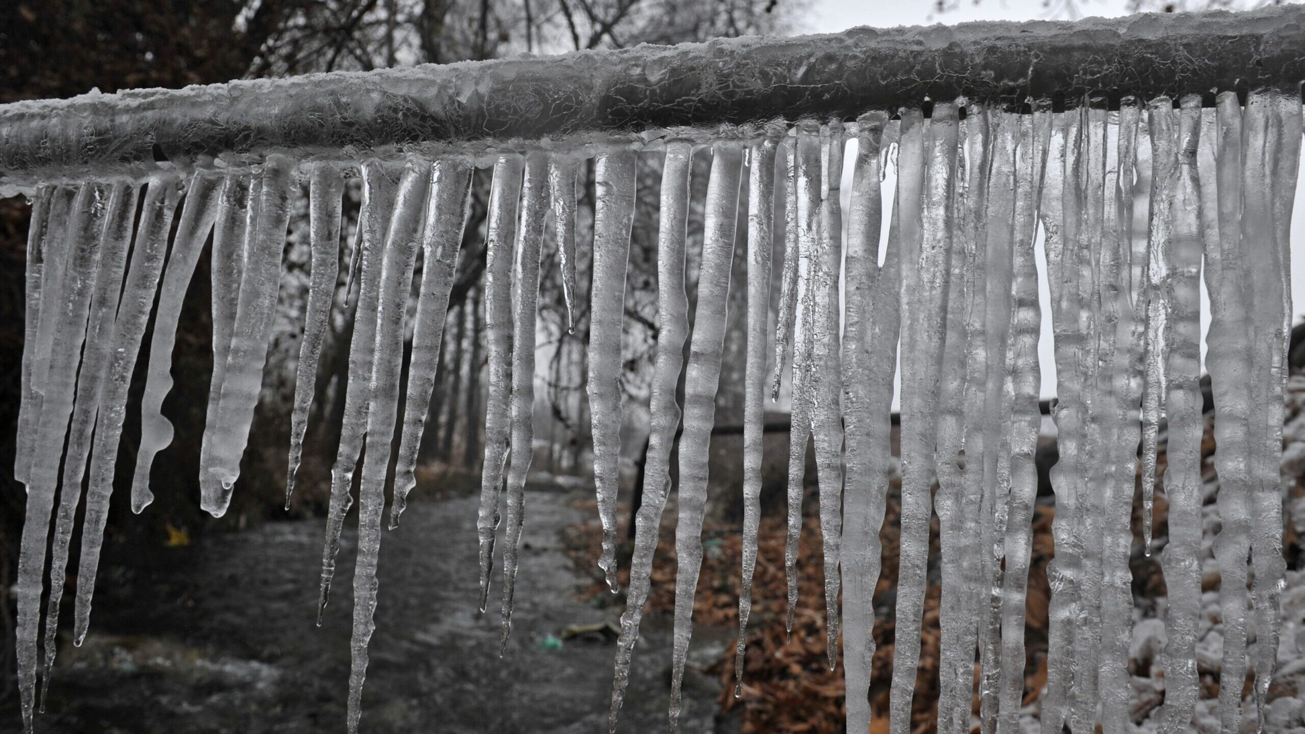 FILE: Icicles hang from a drinking water pipe at Shopian some 65kms south of Srinagar on January 5,...