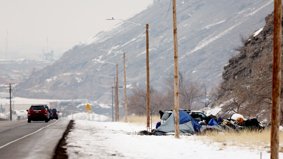 a homeless camp on the side of the road is pictured. The Utah homeless population is increasing, al...