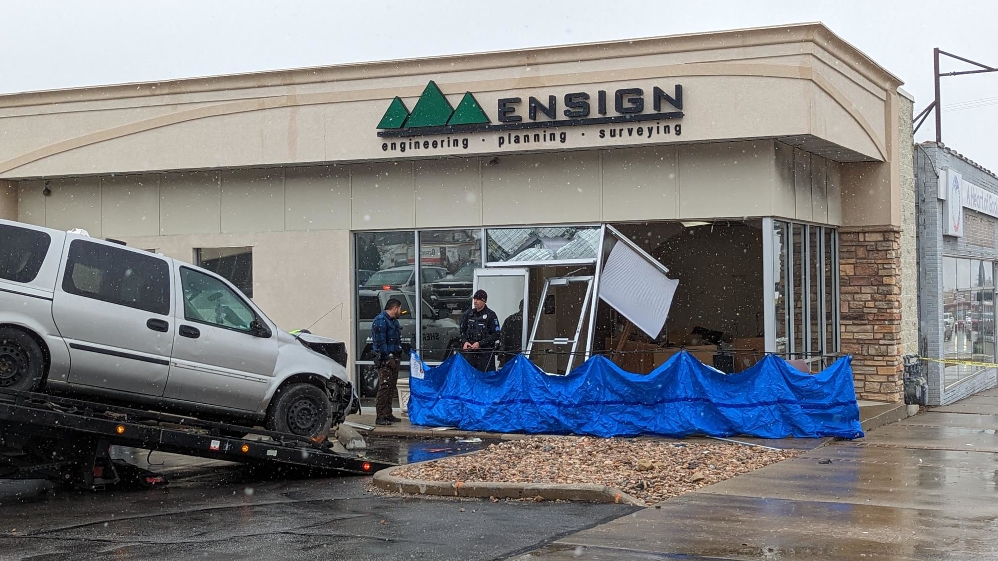 a car crashed into a building in tooele is pictured...