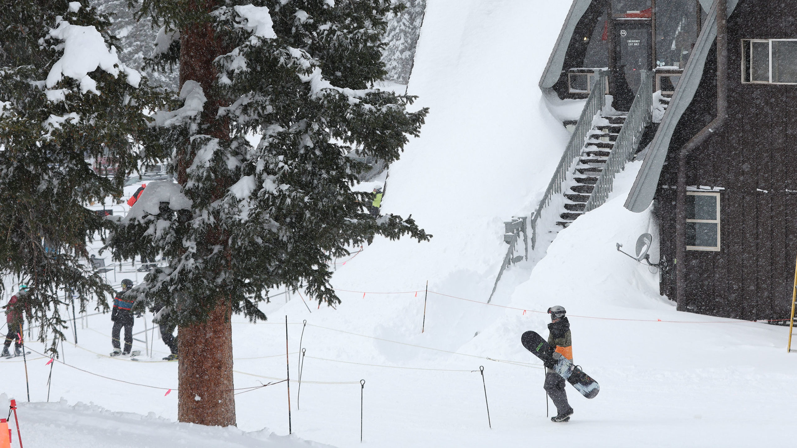 a snowboarder is pictured in a snowy area in utah ski resort...