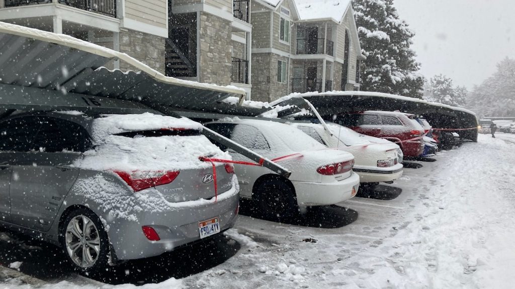 Ten vehicles were damaged at a West Jordan, Utah, apartment complex after a carport collapsed on Su...