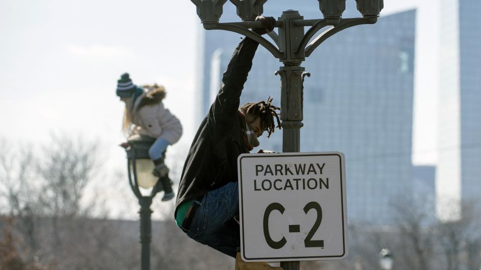 (Eagles fans climbing lamposts after superbowl win 2018 - photo coutesy of NVC Sports)...