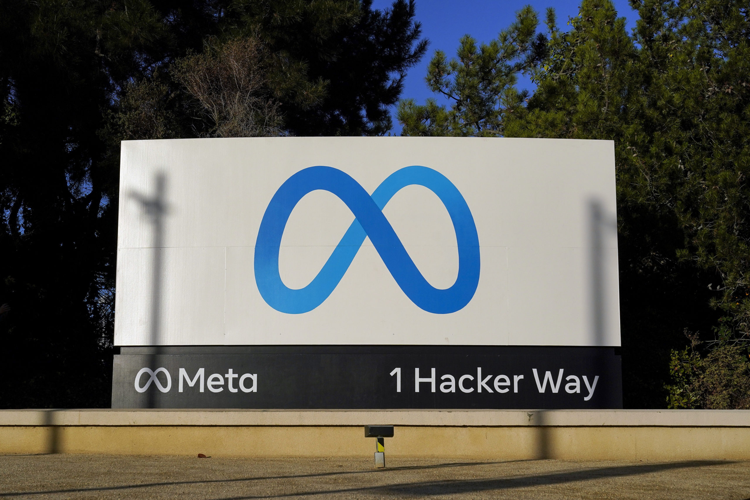 FILE - Meta's logo can be seen on a sign at the company's headquarters in Menlo Park, Calif., Nov. ...