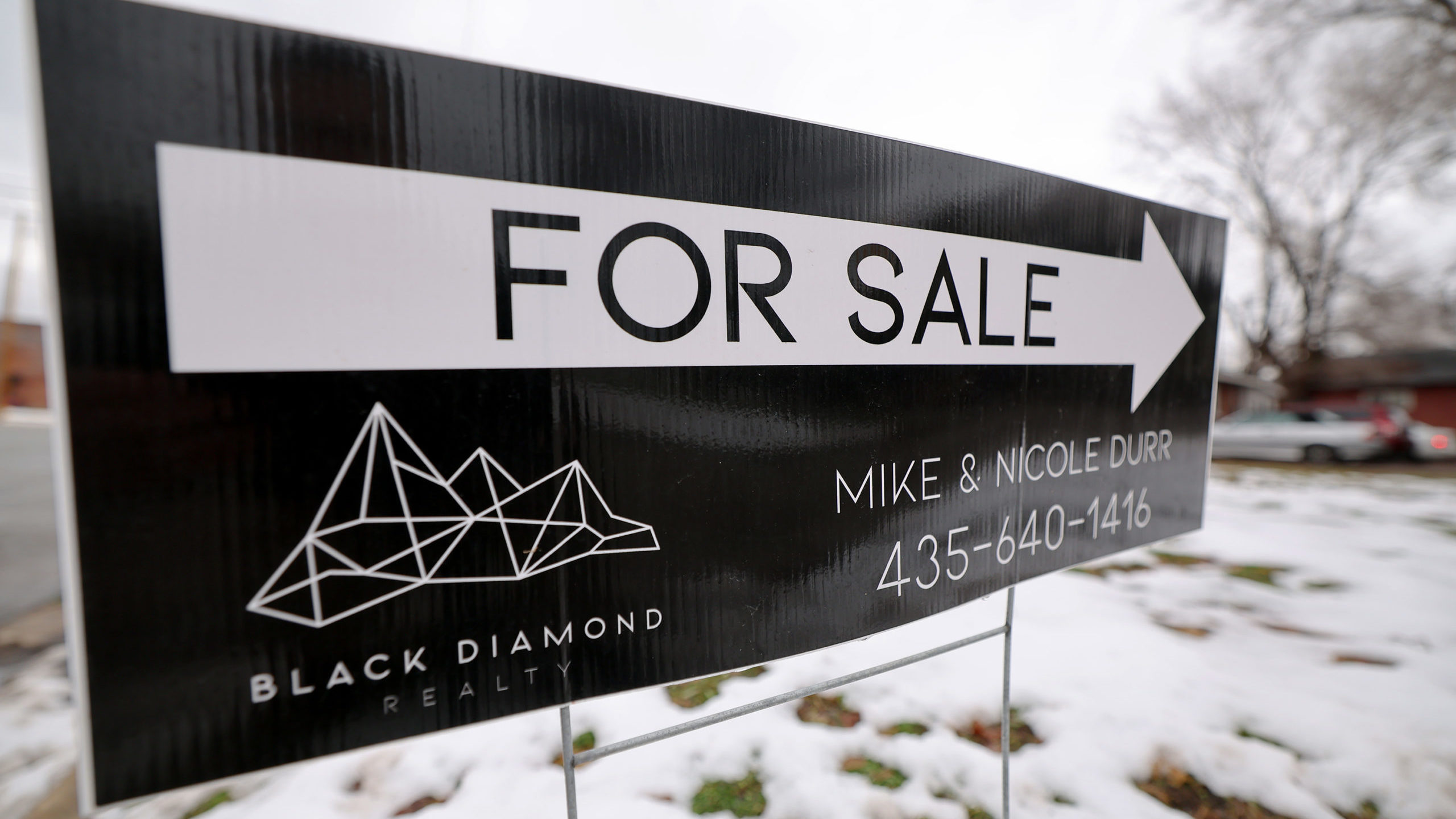 a for sale sign is pictured, utah housing is still too expensive for most...