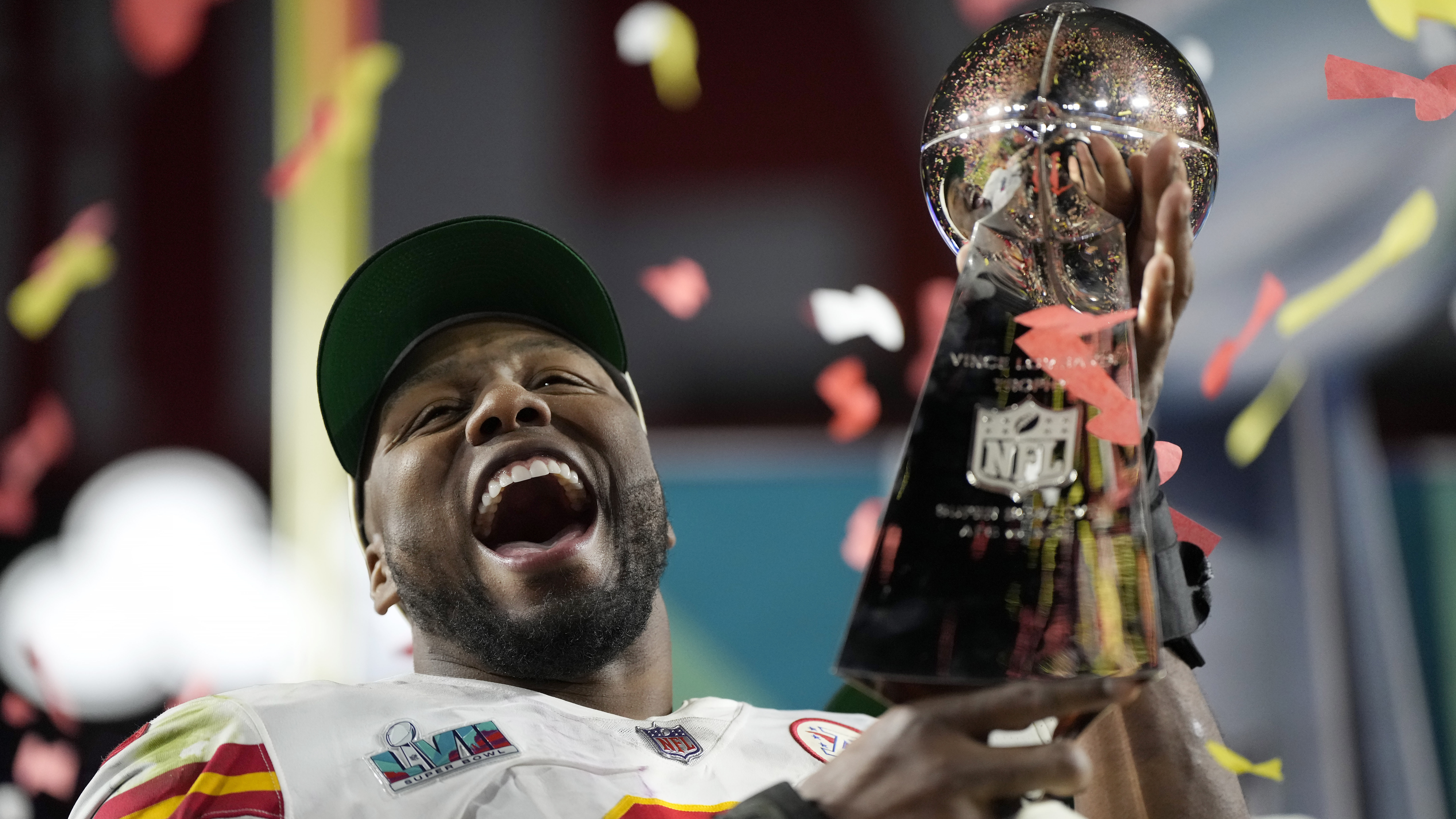 Kansas City Chiefs defensive end Carlos Dunlap celebrates with the Vince Lombardi Trophy after the ...