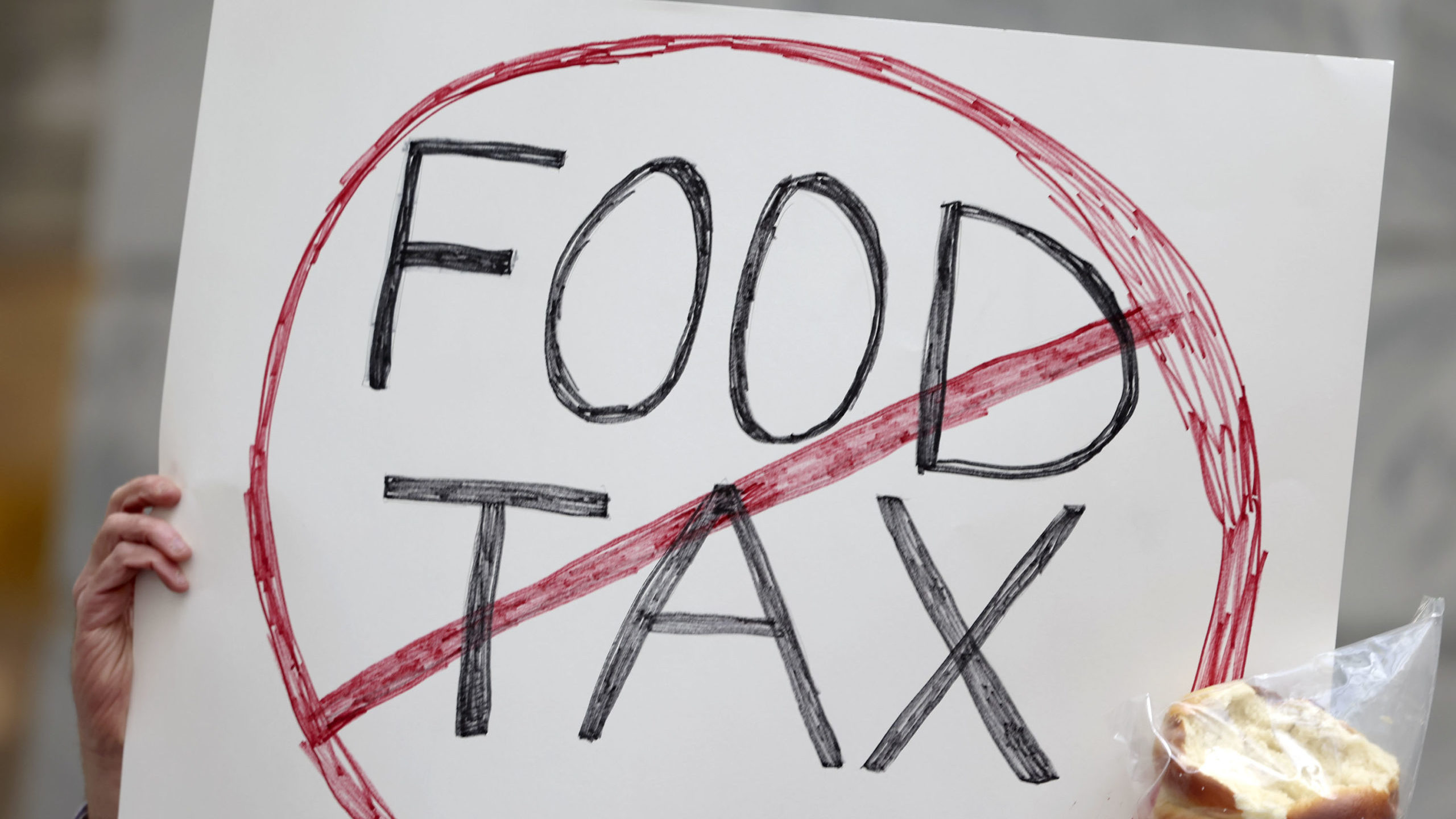 a sign opposing utah food tax is pictured...