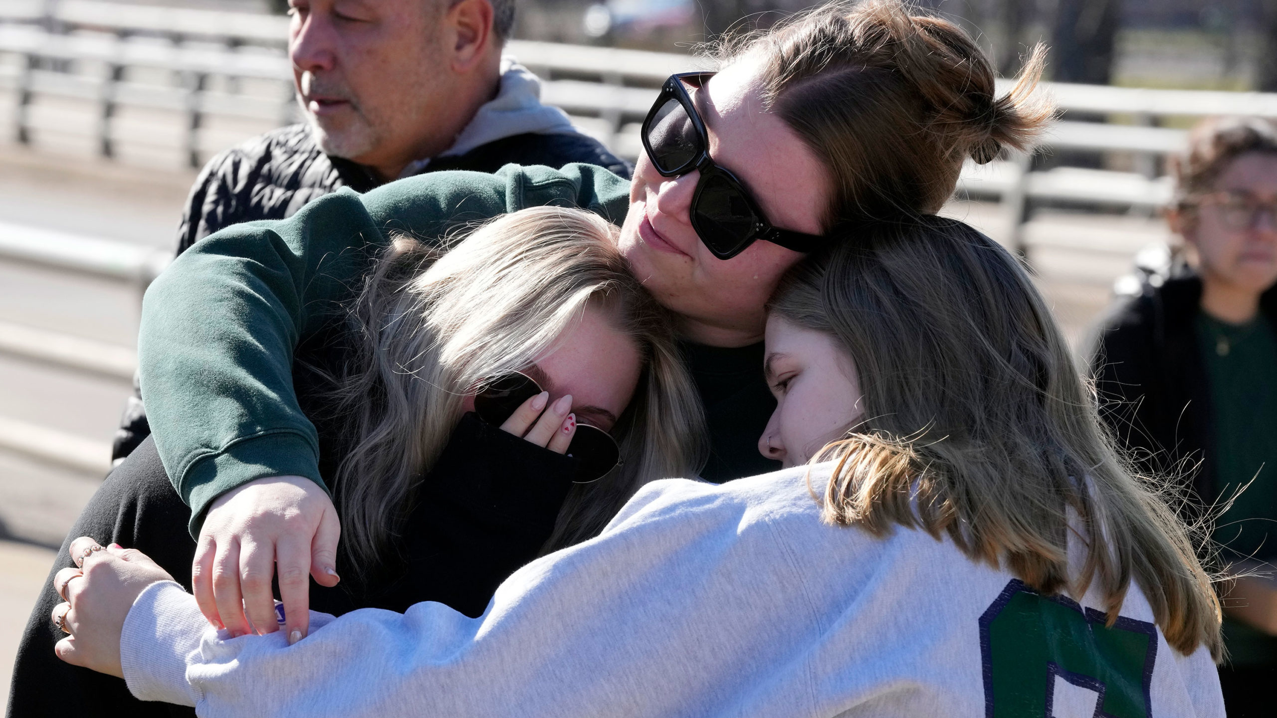 students react tearfully to Michigan shooting...