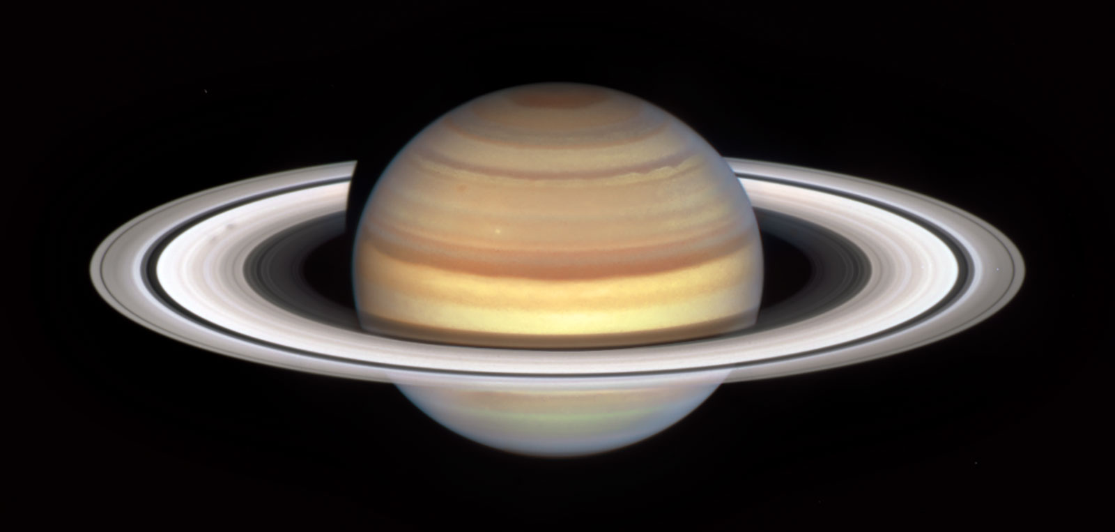 An image captured by NASA's Hubble Space Telescope's marks the start of Saturn's "spoke season," wi...