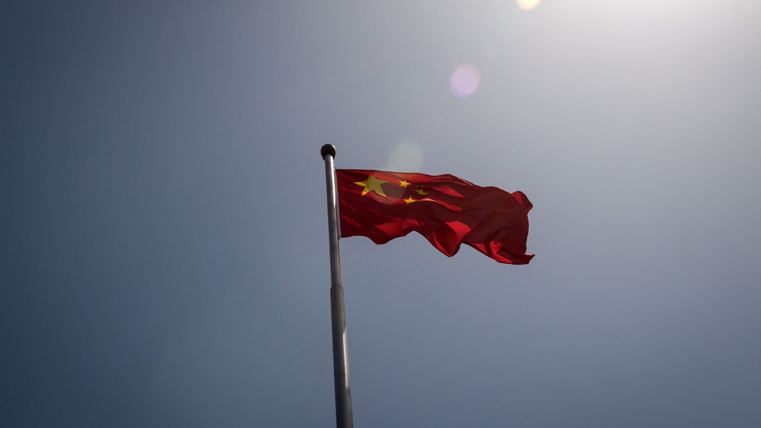 The Chinese national flag is seen at the entrance to the Zhongnanhai leadership compound in Beijing...