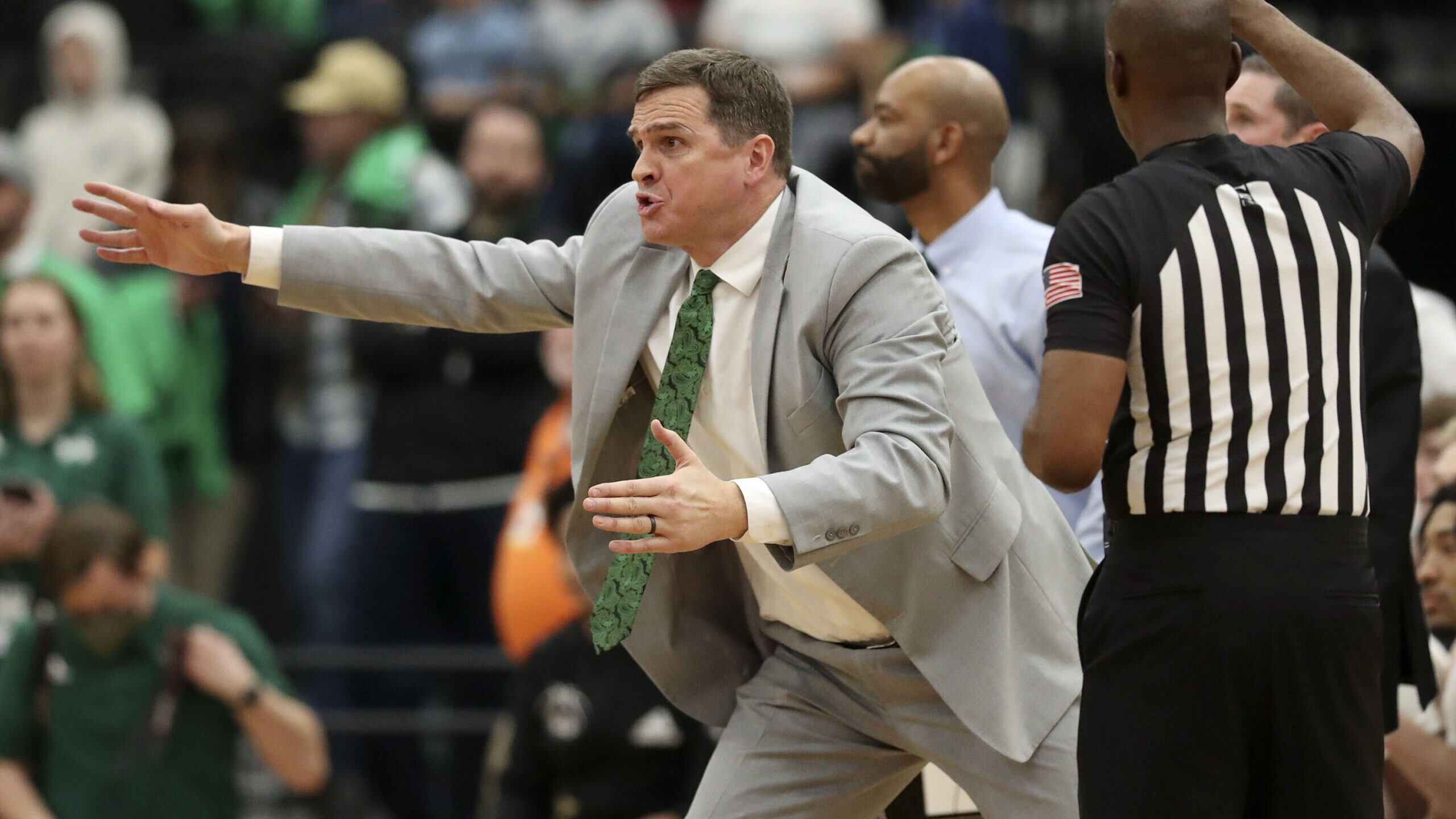 Utah Valley University coach Mark Madsen directs his players during a basketball game against BYU a...