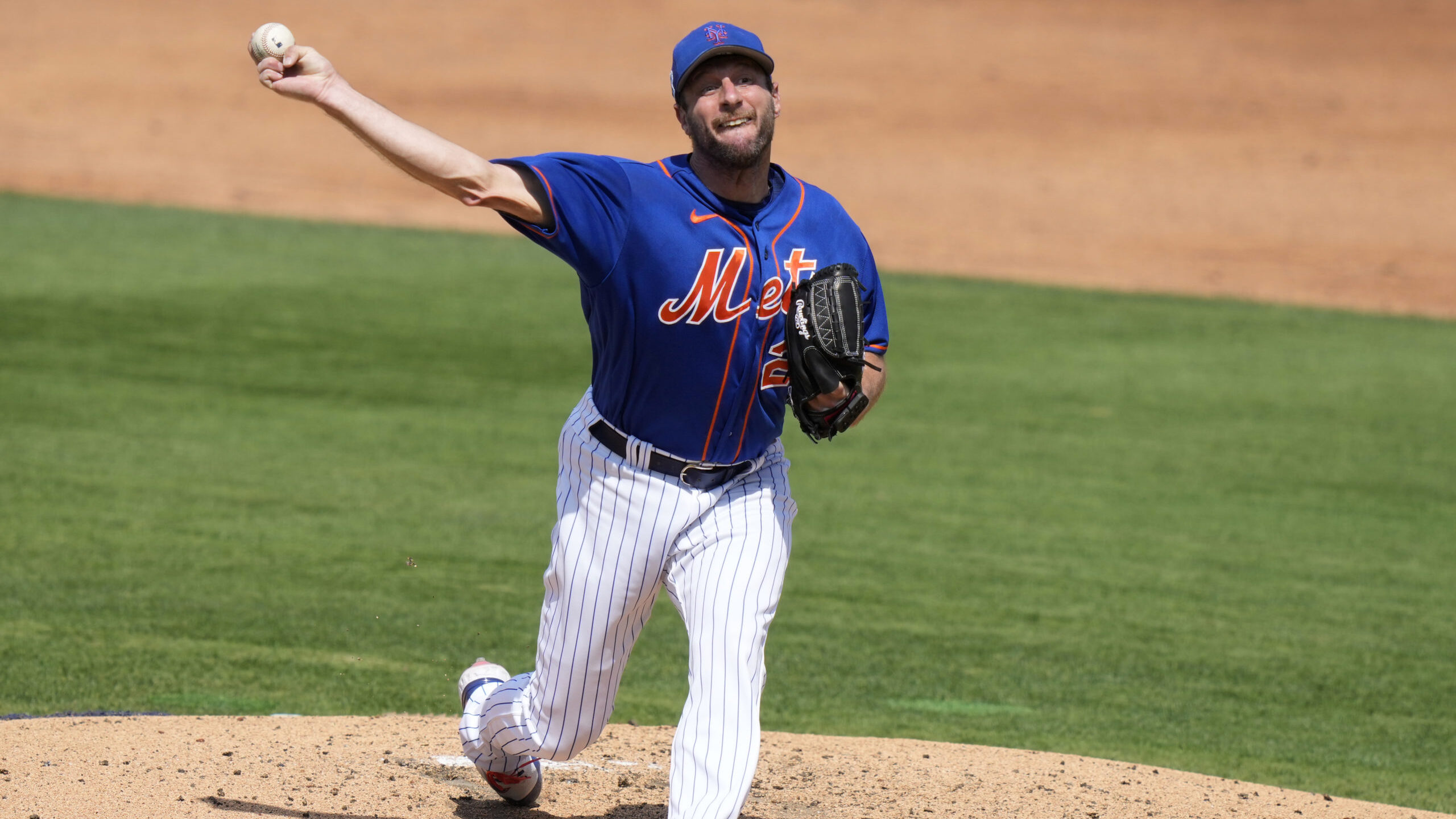 New York Mets starting pitcher Max Scherzer throws during the third inning of a spring training bas...