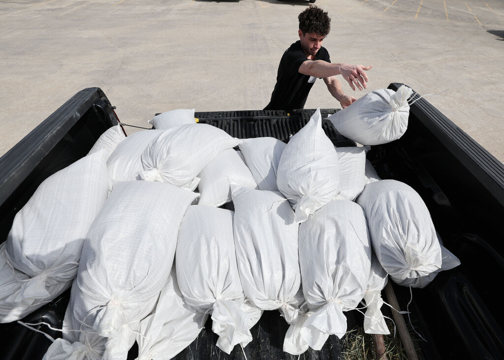 Mike McComb loads sand bags in his truck at the Salt Lake County Public Works Operations Division i...