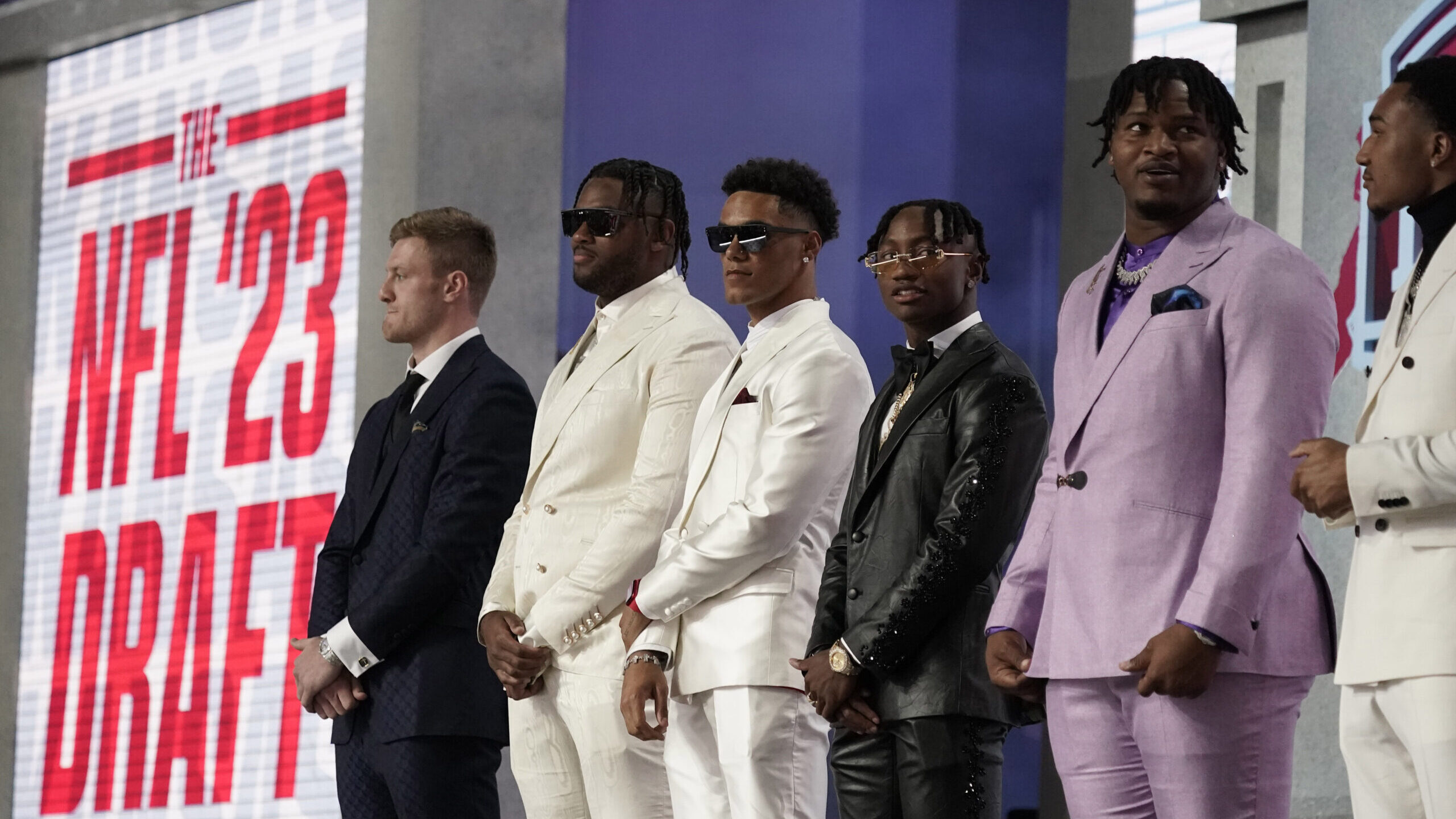 Draft prospects stand on stage before the first round of the NFL football draft, Thursday, April 27...