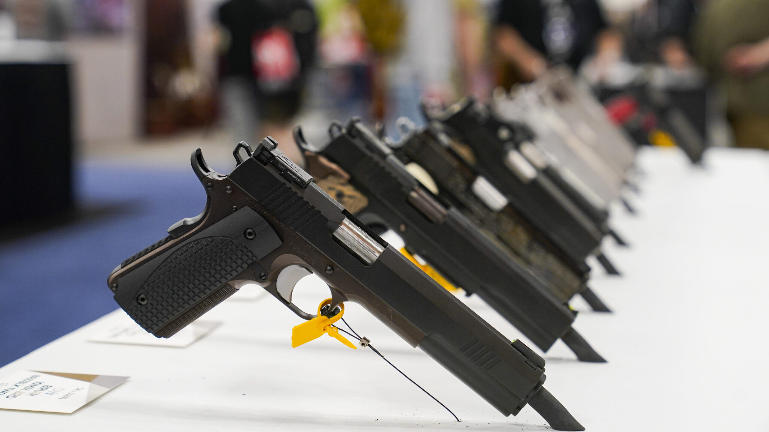FILE - An array of pistols are shown in the Dan Wesson display as guests browse firearms at the Nat...