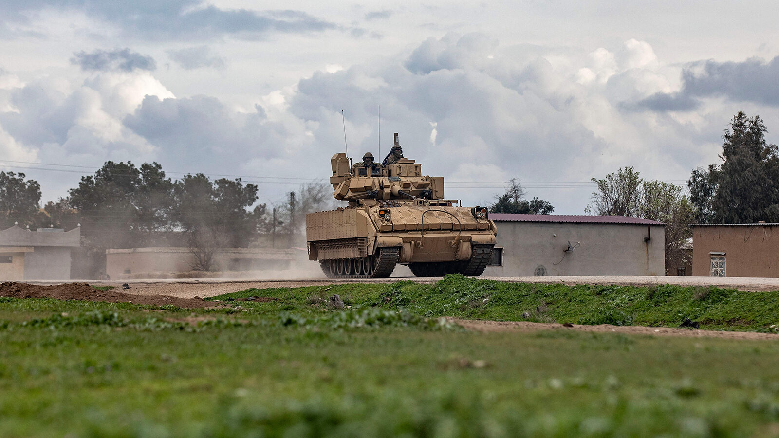 A US armoured military vehicle drives on the outskirts of Rumaylan in Syria's northeastern Hasakeh ...