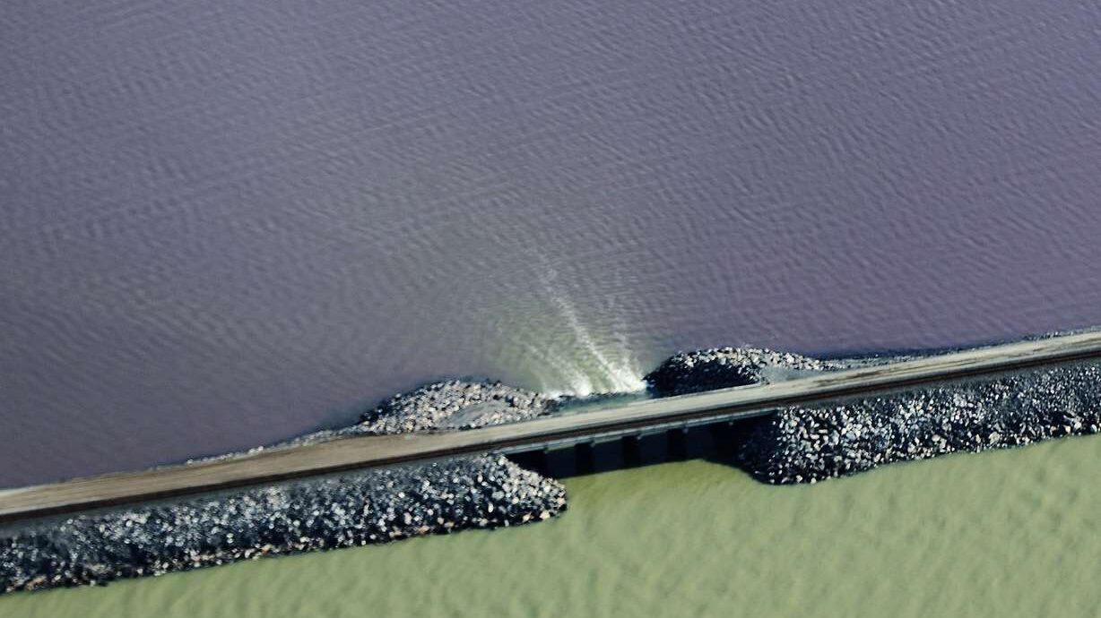 The railroad causeway is breached on the Great Salt Lake on Wednesday. (Photo: Jeffrey D. Allred, D...
