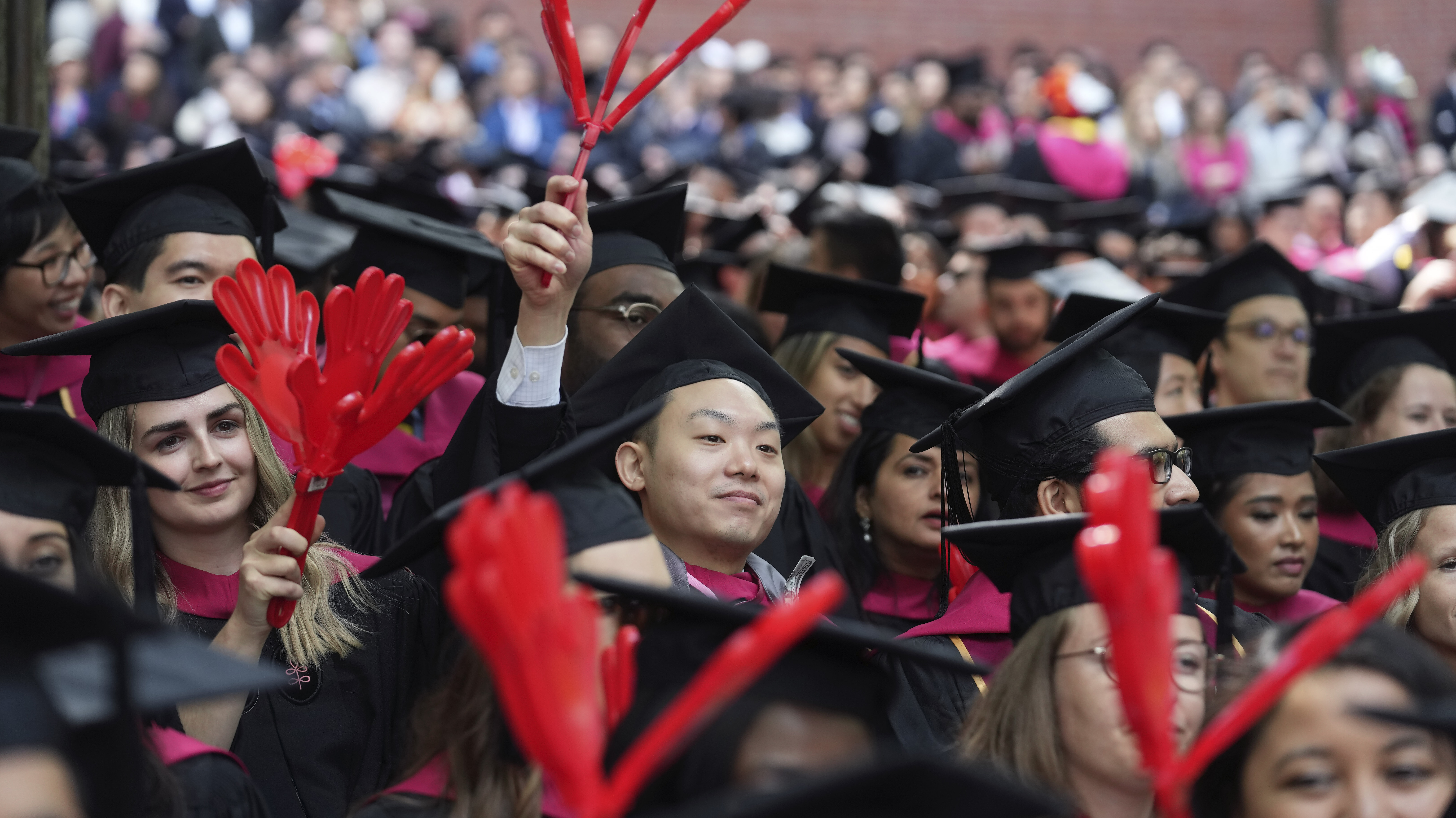 File - Harvard University students celebrate their graduate degrees in public health during Harvard...