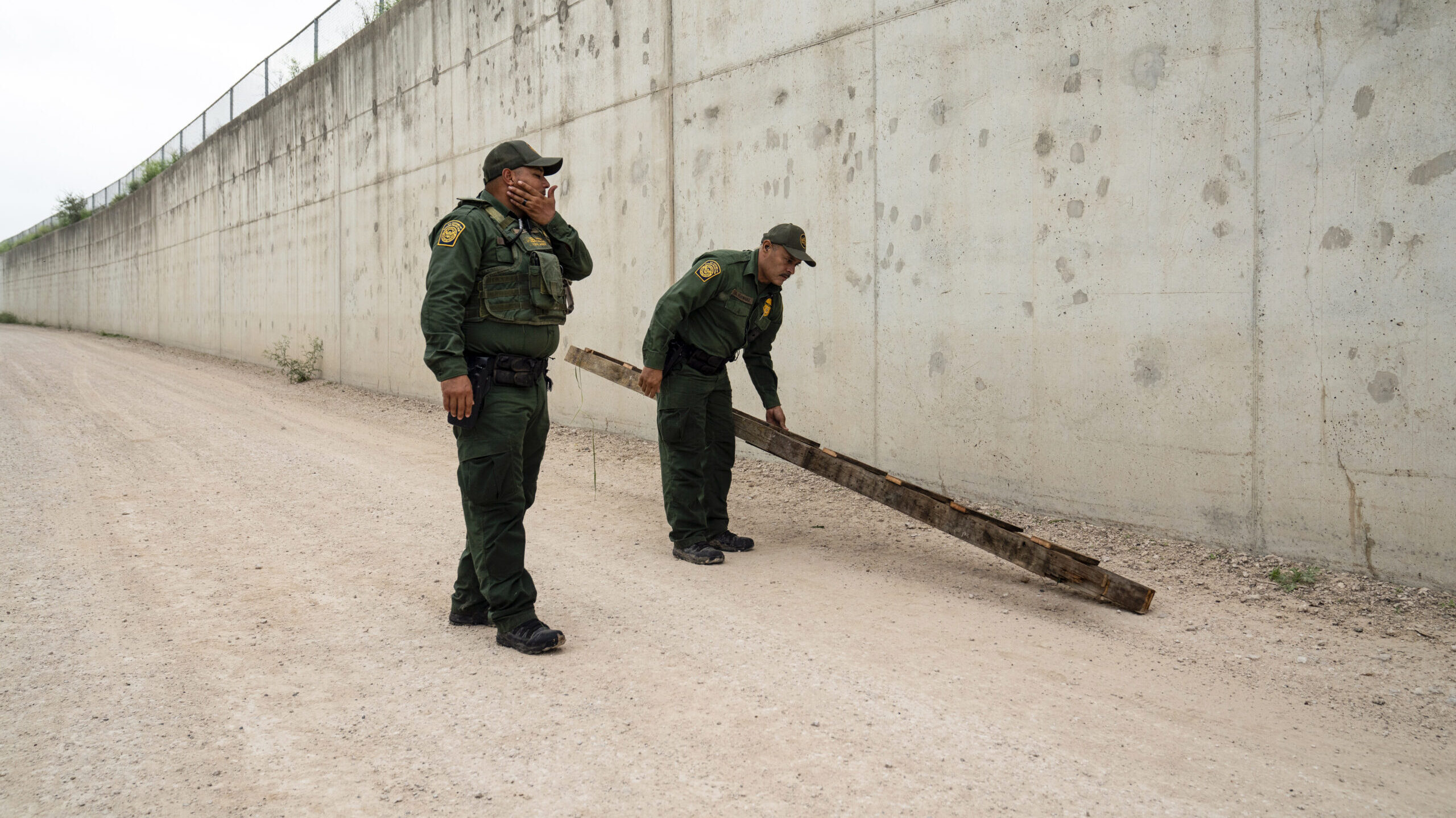 two border patrol agents pictured, agents are dealing with a surge as title 42 reaches its expirati...