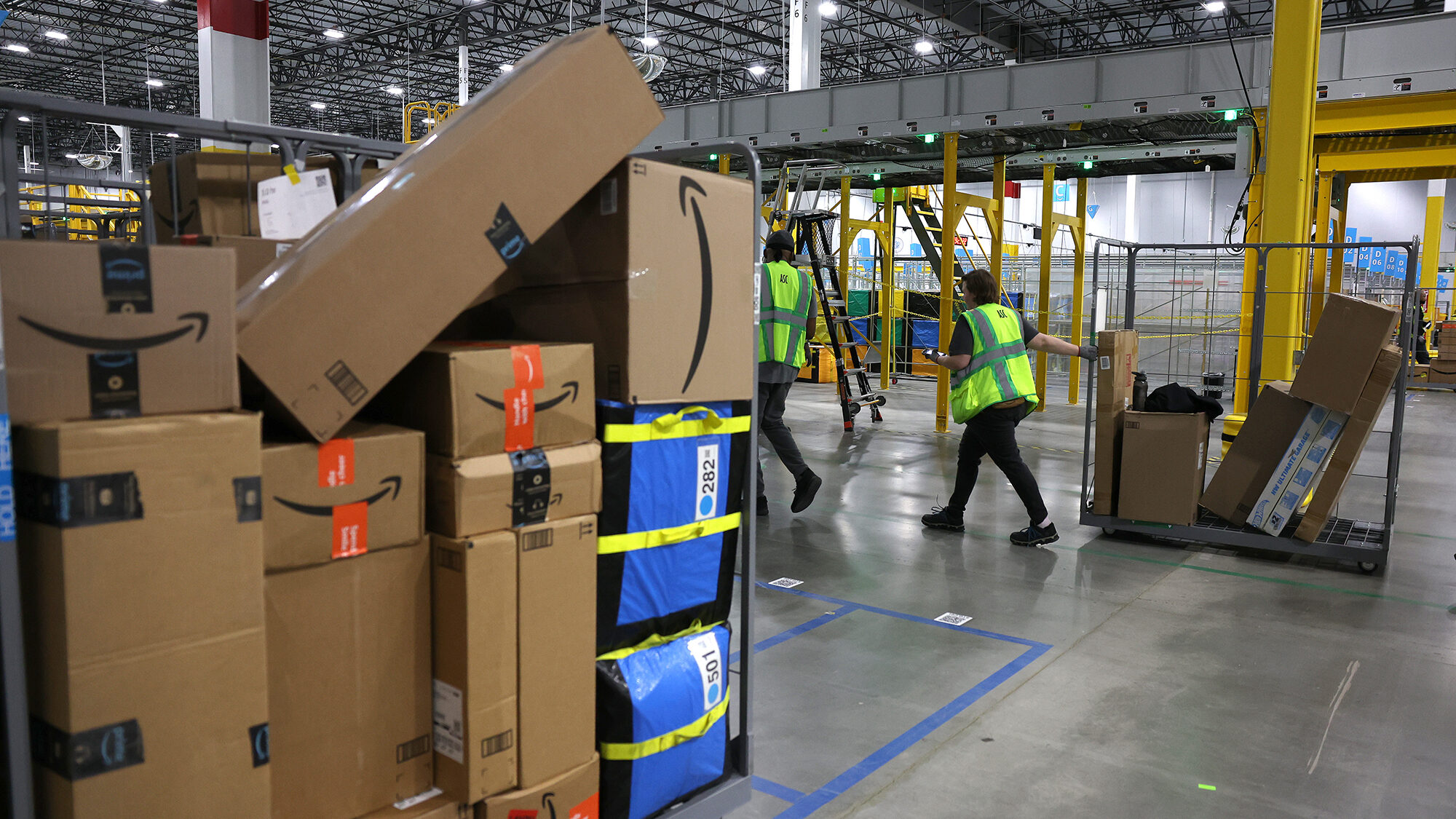 Amazon is revamping its delivery operations in an effort to cut costs while speeding up shipping ti...