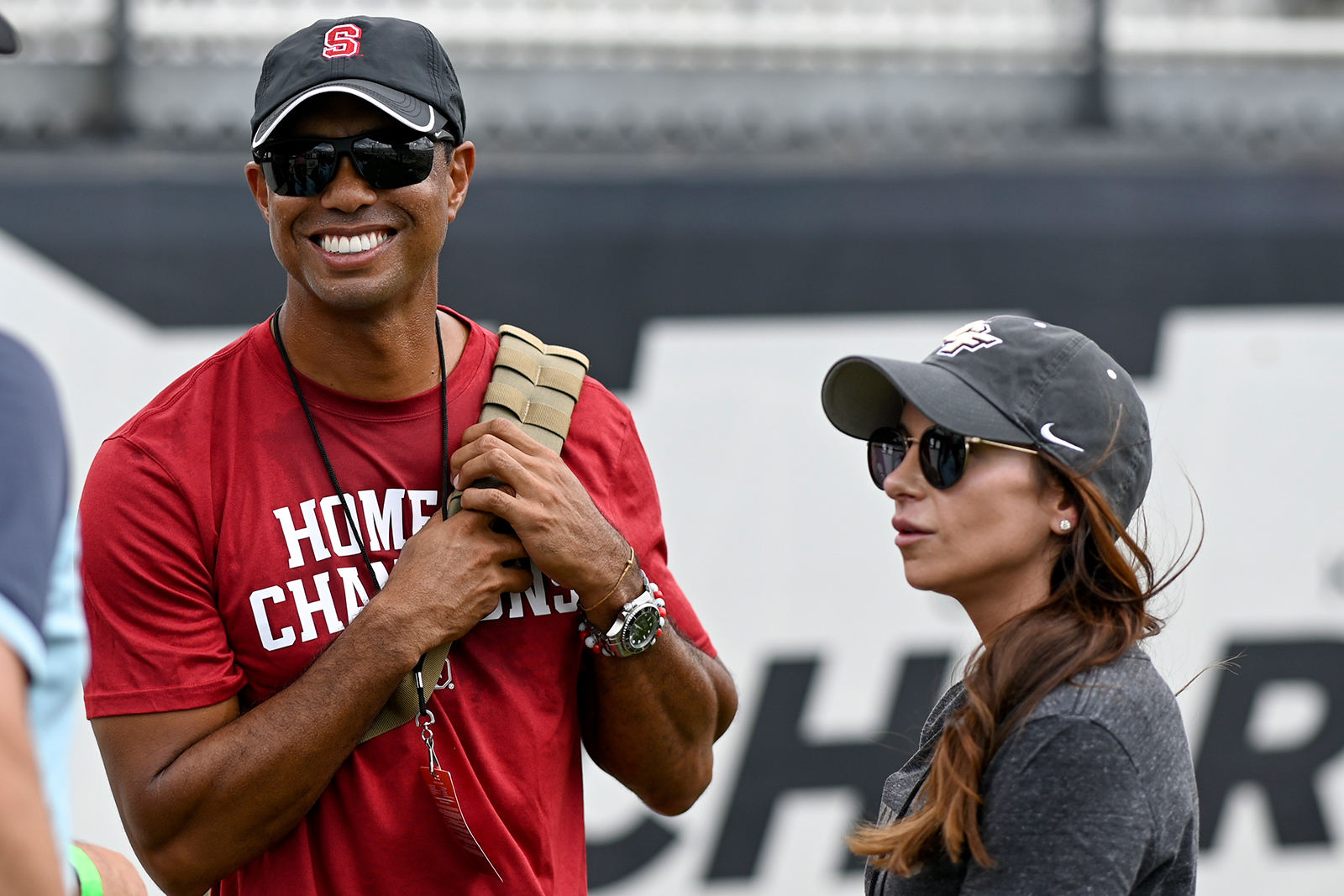 Sep 14, 2019; Orlando, FL, USA; PGA golfer Tiger Woods (red shirt) and girlfriend Erica Herman look...