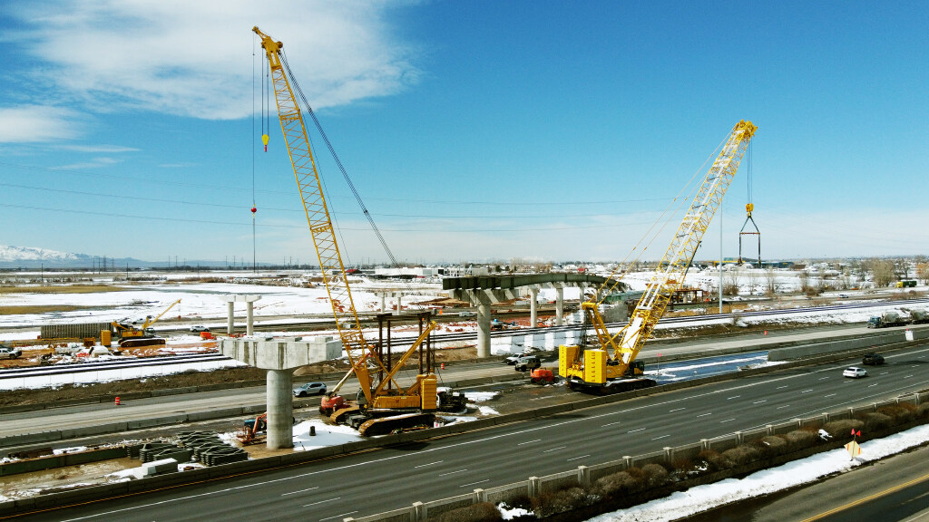 Workers construct a bridge over I-15 on the West Davis Corridor near Farmington on Tuesday, March 2...