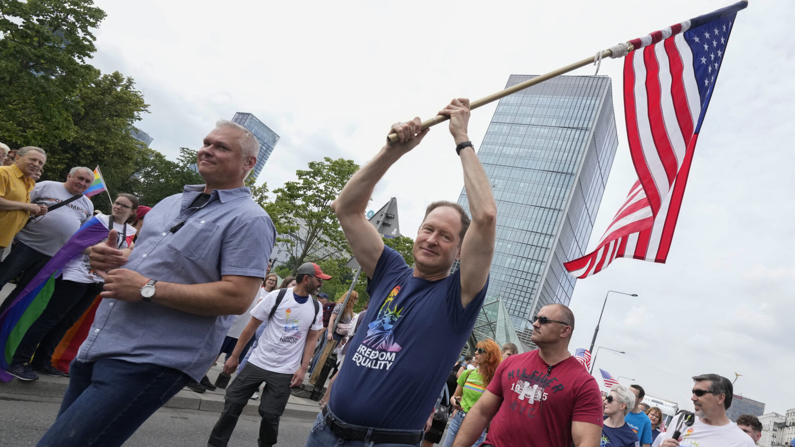 The United States ambassador held a U.S. flag high as he marched in the yearly Pride parade in Wars...