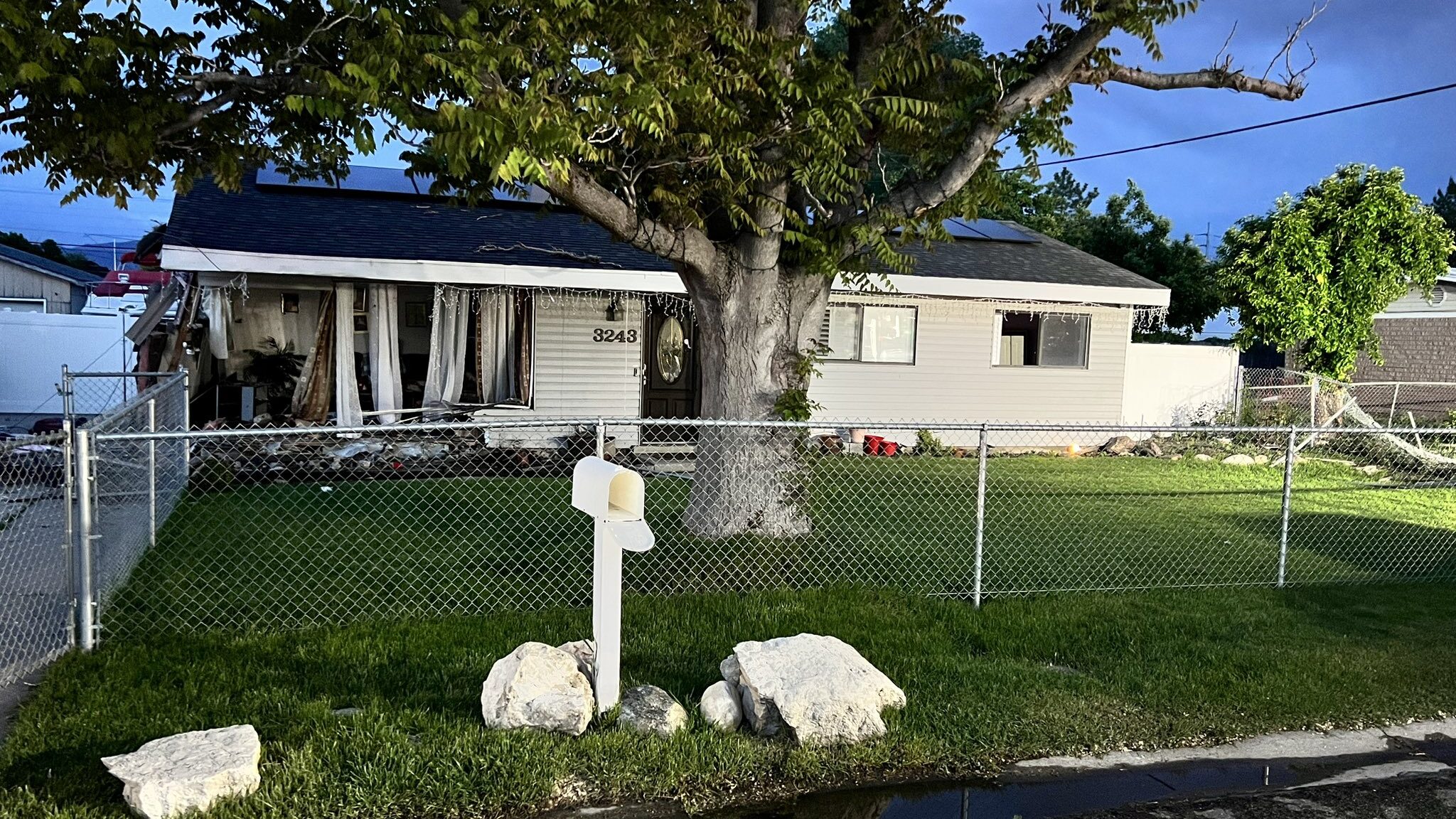 a house damaged in a west valley car crash is pictured...