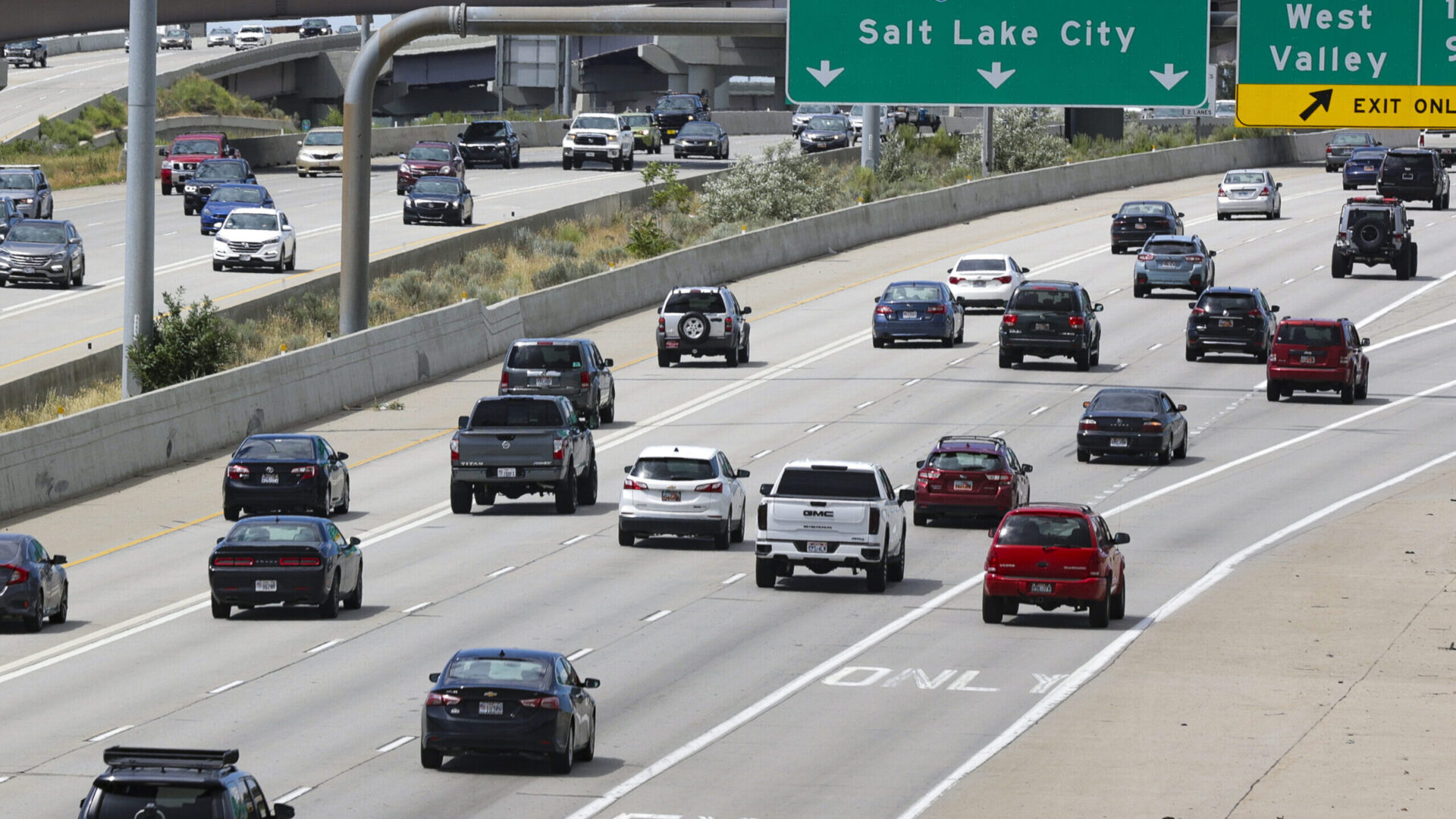 Traffic moves along I-15 during rush hour in Salt Lake City. Rollover crash sends one to the hospit...