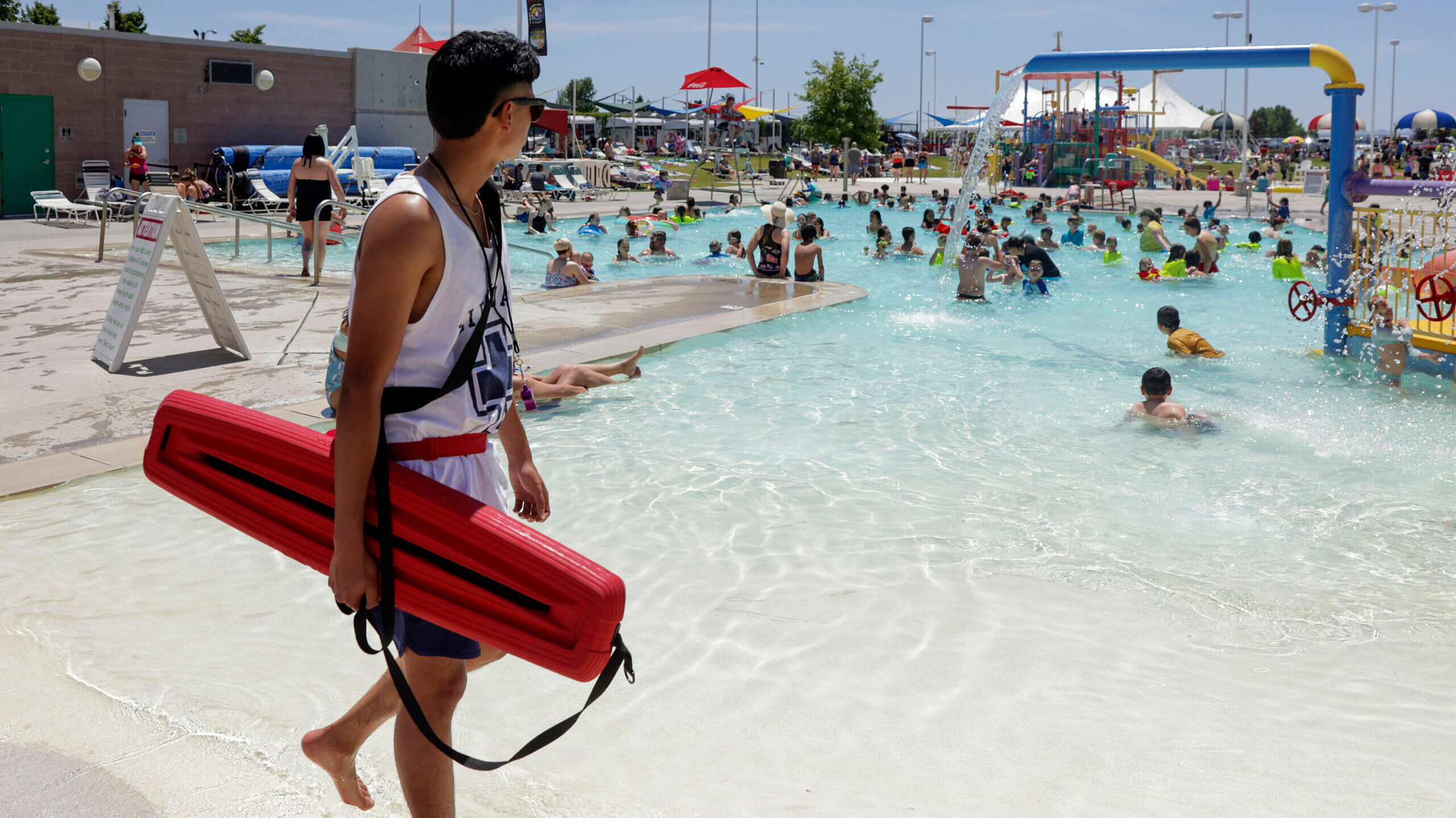 FILE: A lifeguard at the Kearns Oquirrh Park Fitness Center watches swimmers at the pool in Kearns ...