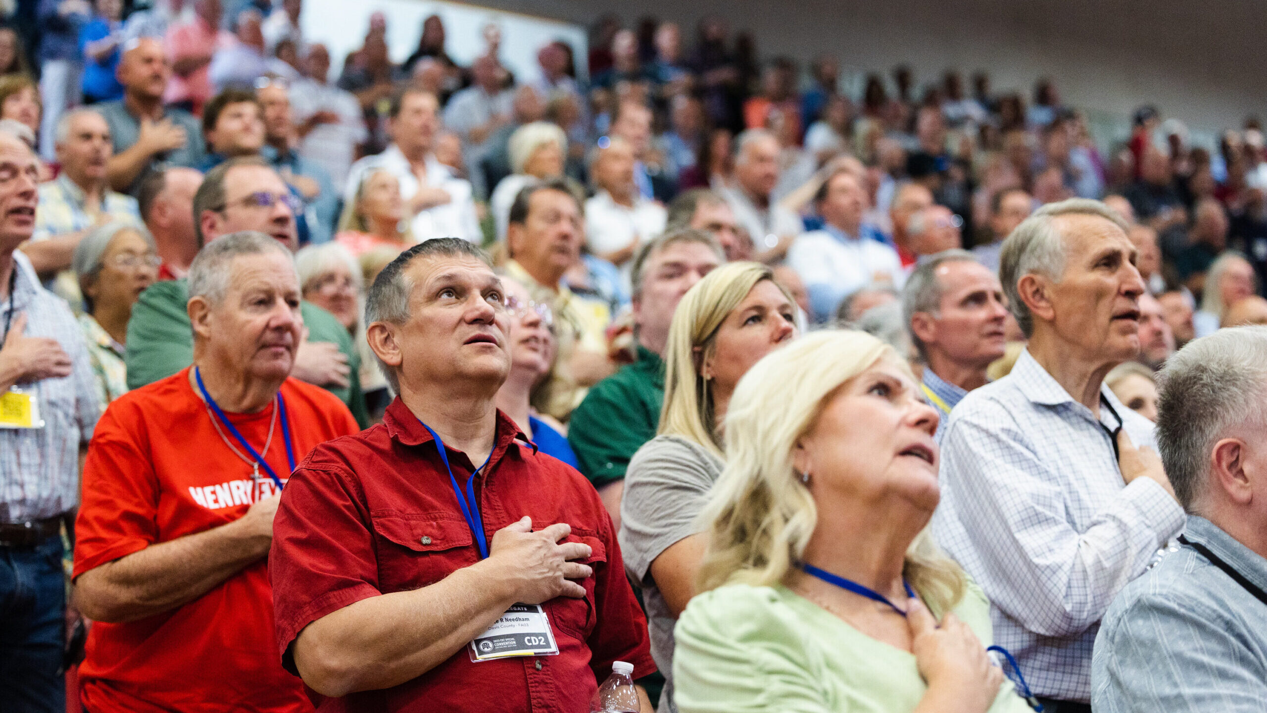 Delegates stand for the national anthem during the Utah Republican Party’s special election at De...