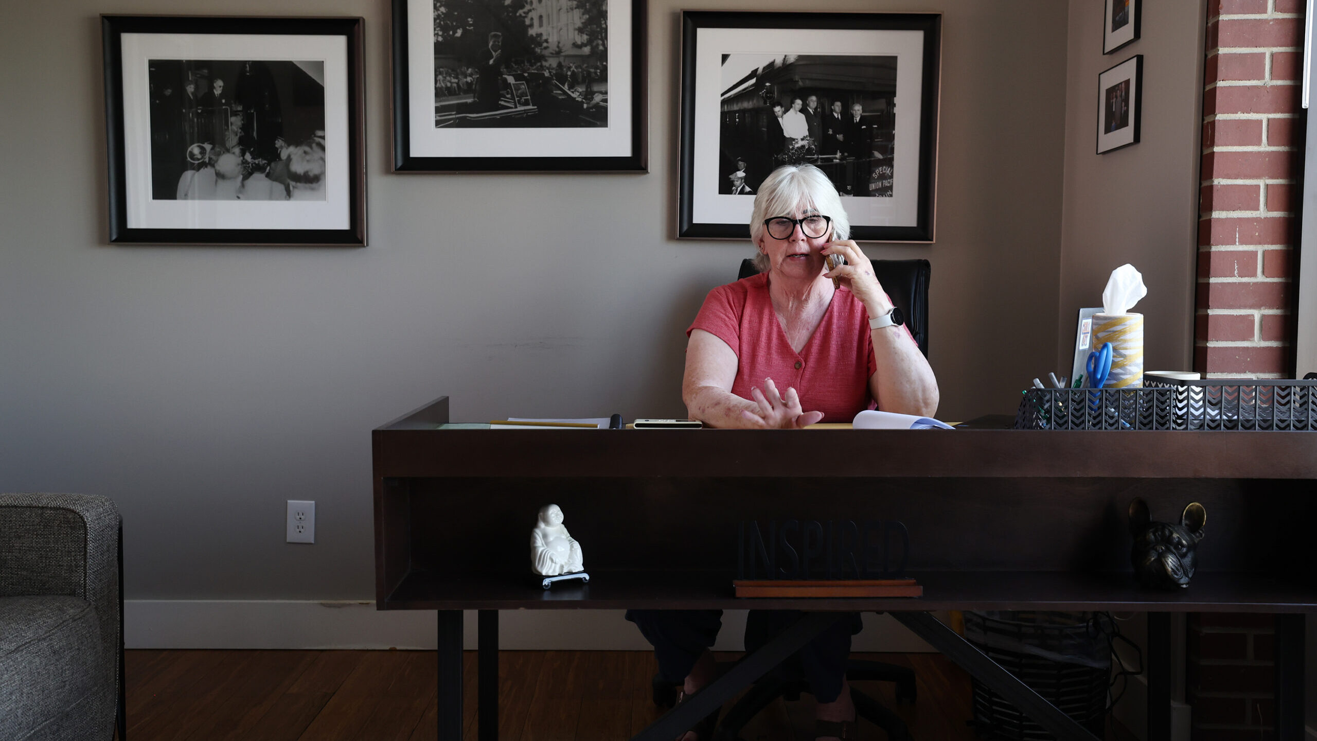Diane Lewis, chairwoman of the Utah Democratic Party, talks on her phone inside her office at the p...