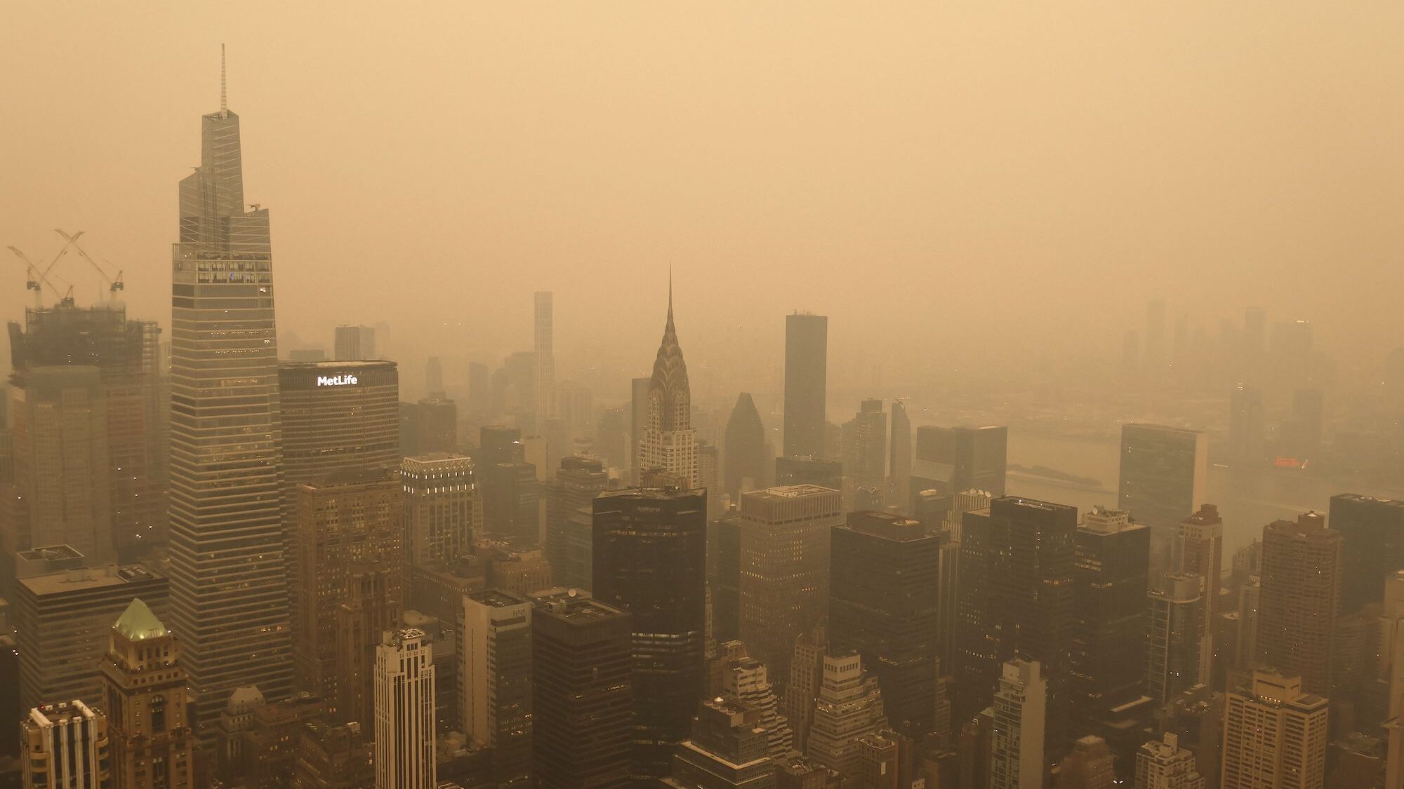 Heavy smoke shrouds the Chrysler Building and One Vanderbilt in a view from the Empire State Buildi...