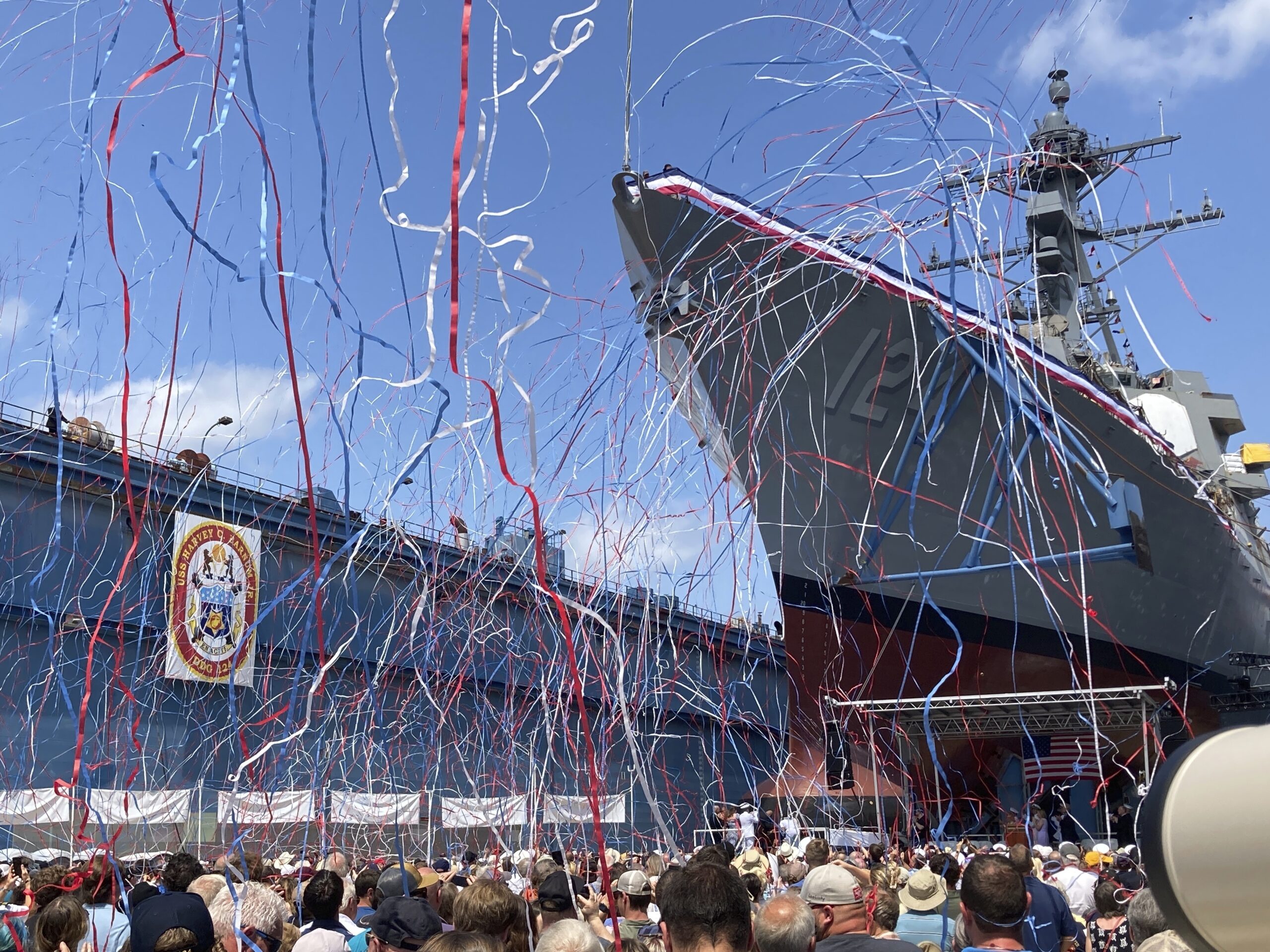 Streamers are shot in the air as a future U.S. Navy destroyer bearing the name of Medal of Honor re...