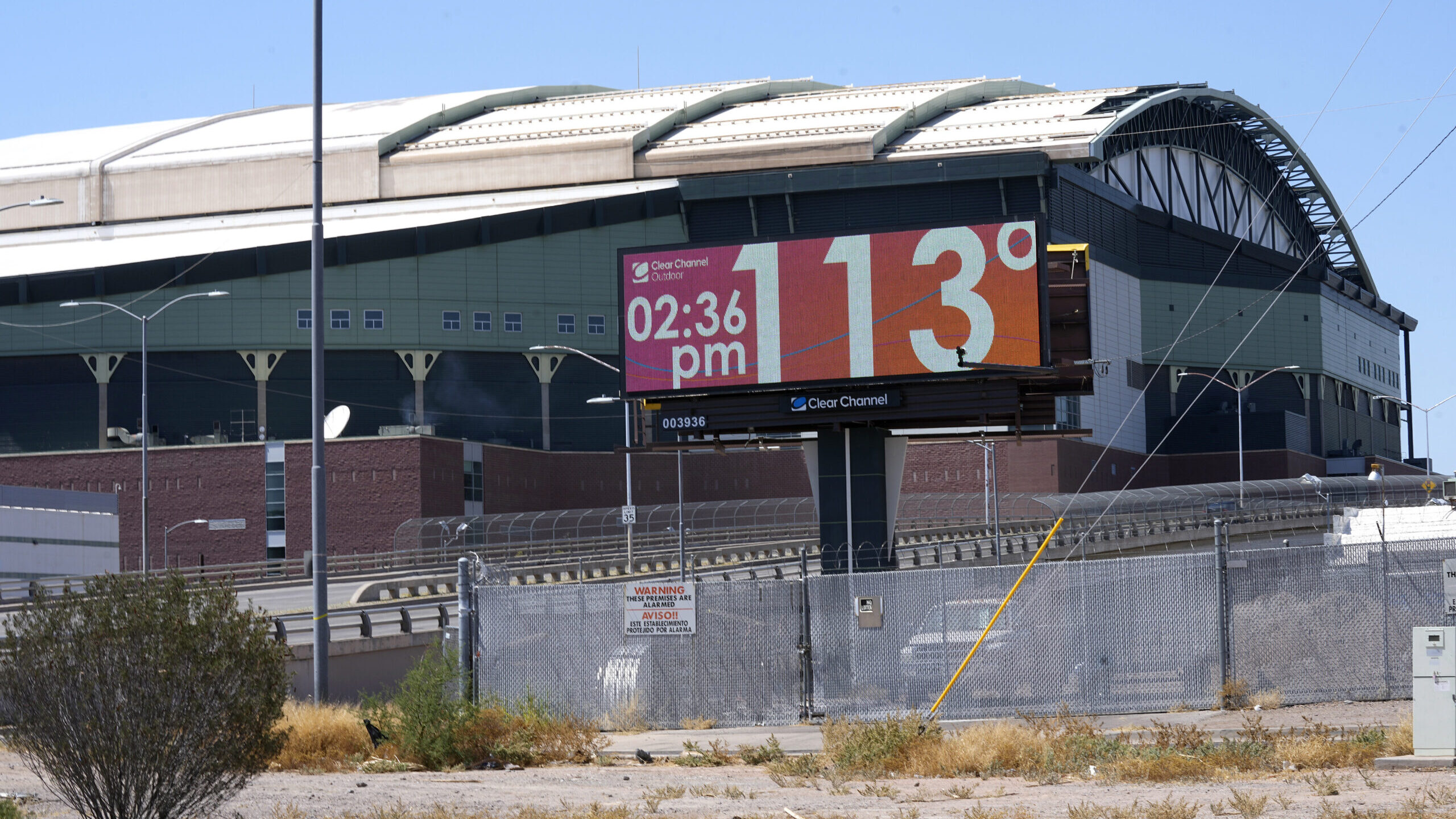 digital billboard shows temperatures are at 113 degrees...