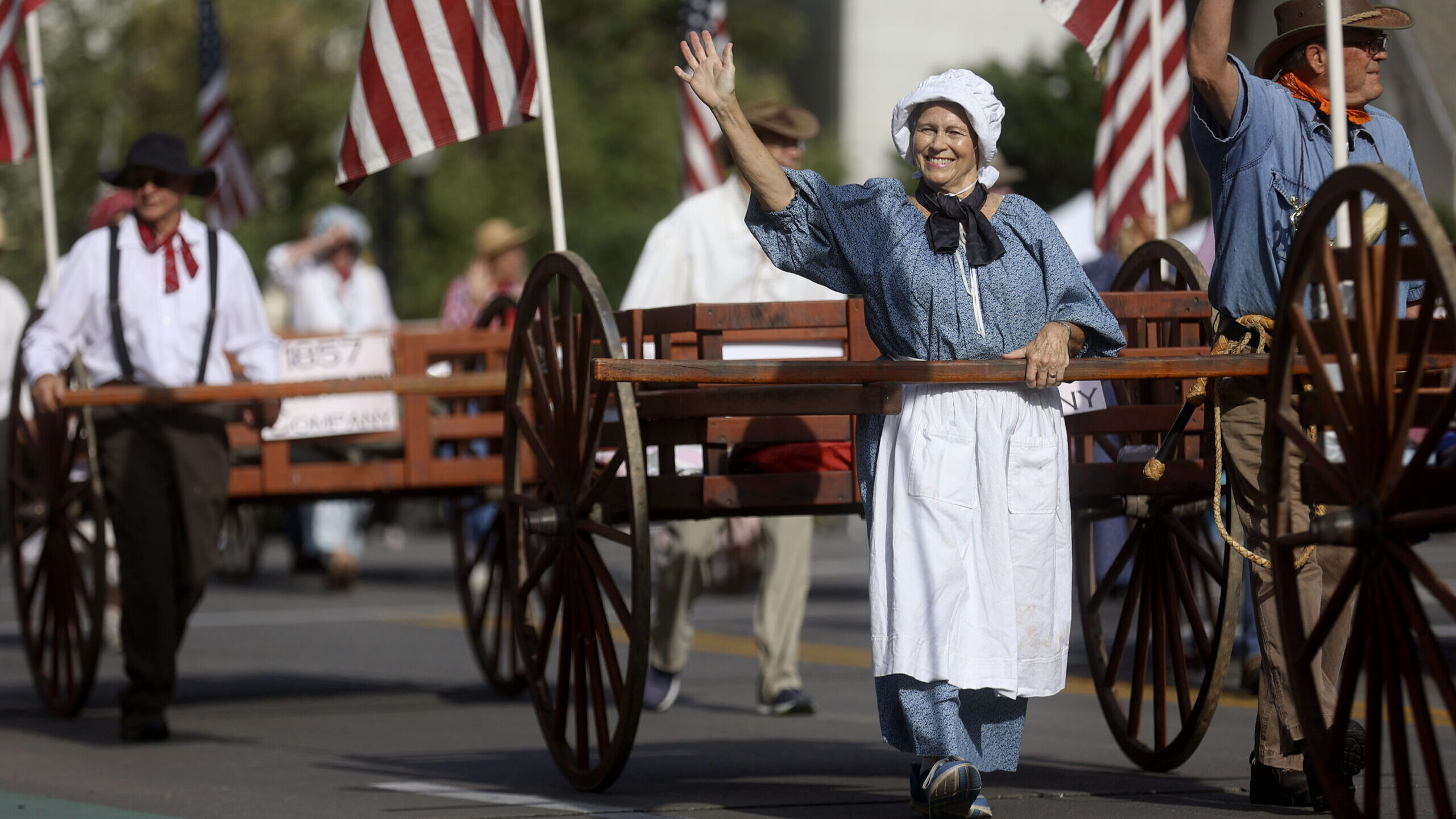 wagons drive down in the pioneer day parade in utah...
