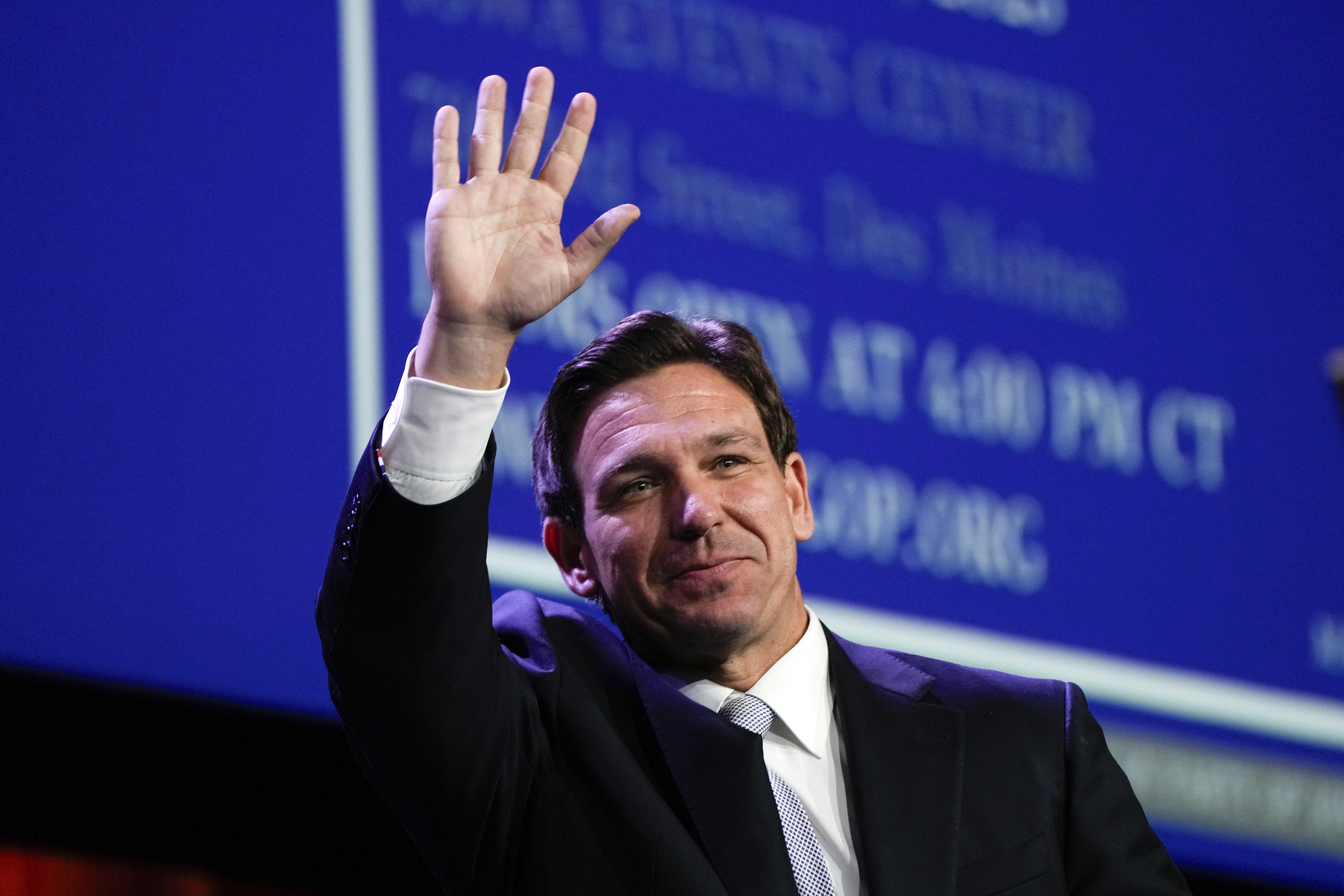 Republican presidential candidate Florida Gov. Ron DeSantis waves at the Republican Party of Iowa's...